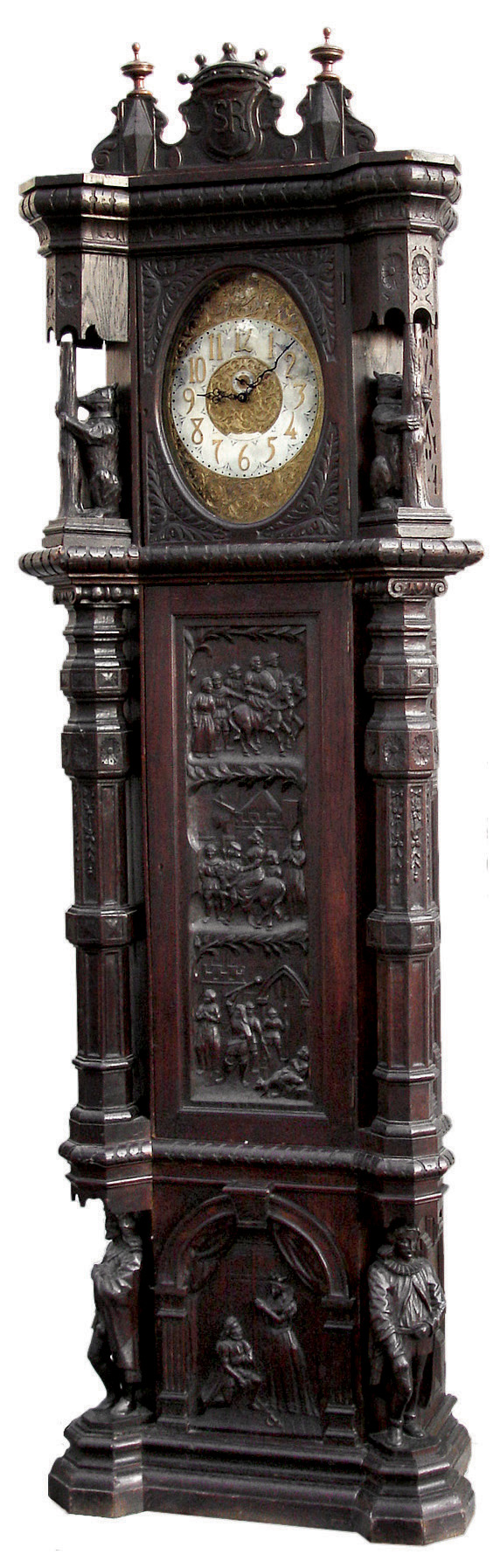 English monumental tall case clock, 8 days, time, strike and chime, three brass weight driven, chain pull Elite, Germany movement in a dark oak case with highly detailed carvings including three panels on the trunk with medieval scenes flanked by carved columns above carvings of gentlemen in medieval garb in full relief and another panel with knight on bended knee. The dial is brass with a silvered chapter ring, c1900 — Antique Clocks Price Guide