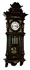 Germany, Vienna regulator, stained hardwood and walnut veneer case, architectural case with divided door, applied, carved split columns, removable carved crest, and applied stamped brass ornament, Roman numeral white enamel dial , pierced steel hands, brass 3 train, weight driven, 8 days, time and strike, movement with grand sonnerie striking, brass pendulum with ebonized wooden rod, and 3 brass weights, c1910