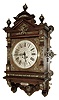 Lenzkirch, Germany, ÓGutsherrenuhrÒ oak cased gallery clock with over 40 brass decorations. 8Ó engraved/ etched and silvered dial, with gold accents, 8 days signed movement, serial Nr 1,112,345, the case with profuse trimmings, even the finials with rings of brass, c1896, and then purchased and presented to Ulrik / Estrid Nielsen for 25 years of service 1880 - 1905.