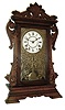Seth Thomas Clock Co., Thomaston, Conn., ÒNewarkÓ shelf clock in a walnut case with a spring driven, 8 days, time and strike, lyre movement