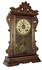 Seth Thomas Clock Co., Thomaston, Conn., ÓNewarkÒ shelf clock with a spring driven, 8 days, time, strike and alarm movement in a walnut case, c1890.