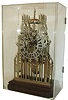 England, a large cathedral form skeleton clock, 7 turned pillars joining the intricately pierced plates, Gothic Roman numeral silvered dial with heart form piercing and scalloped edges, blued steel hands, 8 days, time and strike, fusee movement with recoil escapement, passing strike on a bell, and counting the hours on a large gong, all mounted to a molded mahogany base, the corners rounded to accept a glass shade, now with a Lexan enclosure, c1870