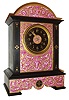 France, for Tiffany & Compy., New York, polished black slate case with porcelain panels bearing Adamesque style ornament on a matte gilt ground, the decoration with trailing vines, bellflowers, pendant husks and bowknots, the central panel with gilt bezel with beveled glass enclosing an Arabic numeral, black slate dial, and flanked by slate pilasters with incised gilt ornament, gilt hands, 8 days, time and strike, pendule a Paris movement, also signed Tiffany & Compy., c1880