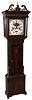 R. Clayton, English tall clock, 8 days, time, strike and calendar, weight driven movement in a mahogany case with crotch veneer door, reeded corner columns flanking trunk door, reeded full columns flanking hood door with gold painted molding above and fretwork broken arch crest. The painted iron square dial has moon phase and is decorated with two birds, c1830