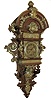 Lenzkirch, Germany, walnut open well or ÓFreischwingerÒ, with built-in top and with approximately 24 pieces of brass decoration and the fancy cast pendulum bob. The well made movement is series number 26 bearing the Lenzkirch logo and serial number 527880, fancy engraved brass dial with gilt highlights, c1873 includes a brass presentation plaque written in old German
