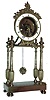 France, gilt bronze mantel timepiece, the oblong base with beaded molding and on turned feet, supporting four slender, tapered columns with reeded, urn form bases, and surmounted with turned urn form finials, the portico supporting the, 8 days, timepiece movement and skeletonized, Roman numeral white enamel dial, silk suspended pendulum with gilt Helios mask, and decorative pierced and chased gilt hands, c1800