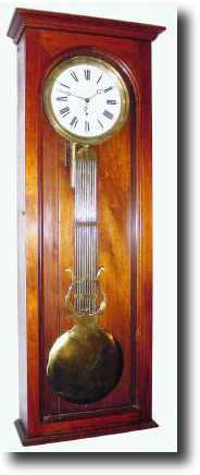 C.1890, Large American wall regulator, with Swiss pinwheel movement in a walnut case. — Antique Clocks Price Guide