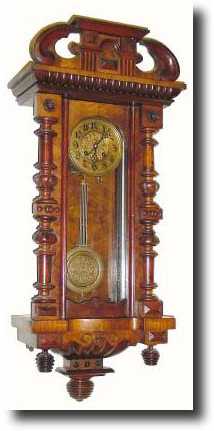 C.1895, German, Kienzle, Walnut Spring regulator, with "flying dial" trademark. — Antique Clocks Price Guide