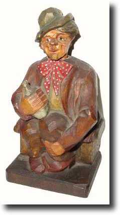 C.1930, German, Seated Drunk whistler with his bottle of booze. — Antique Clocks Price Guide