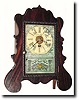 C.1852, Brewster Mfg. Co. miniature lyre front alarm timepiece.