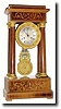 C.1840, French, 4-Column Empire clock in rosewood with satinwood inlay.