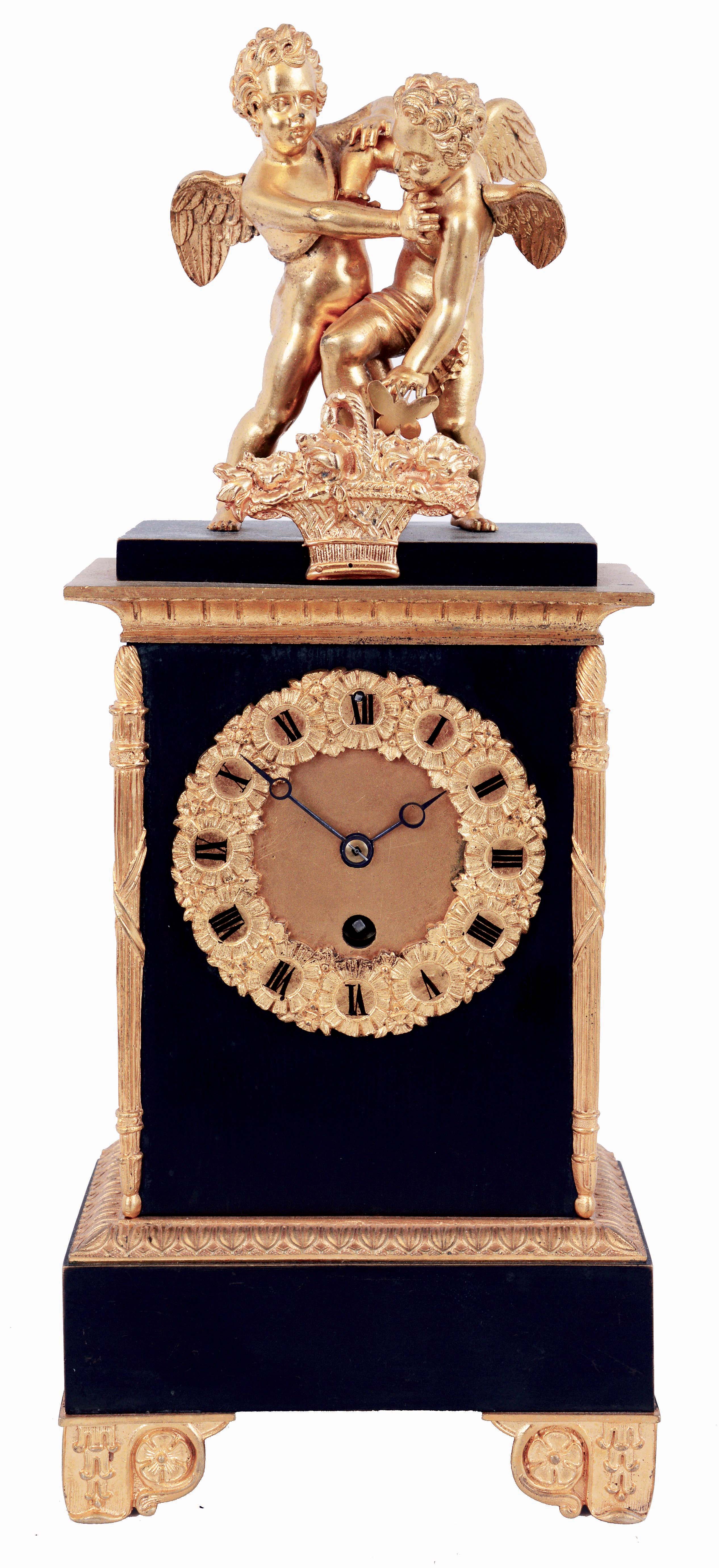 France, mantel timepiece, gilt and patinated bronze case, rectangular base on gilt feet with Grecian ornament, supporting a patinated mid section, with Roman numeral gilt dial, each figure within a floral cartouche, blued steel Breguet style hands, fasces and torch corners, and deeply molded cornice with foliate ornament, and surmounted by a pair of putti, one chasing a butterfly around a basket of flowers, and being restrained by the other, the butterfly attached to the pallet arbor and moving back and forth as the clock runs, 8 day timepiece movement, c1830 — Antique Clocks Price Guide