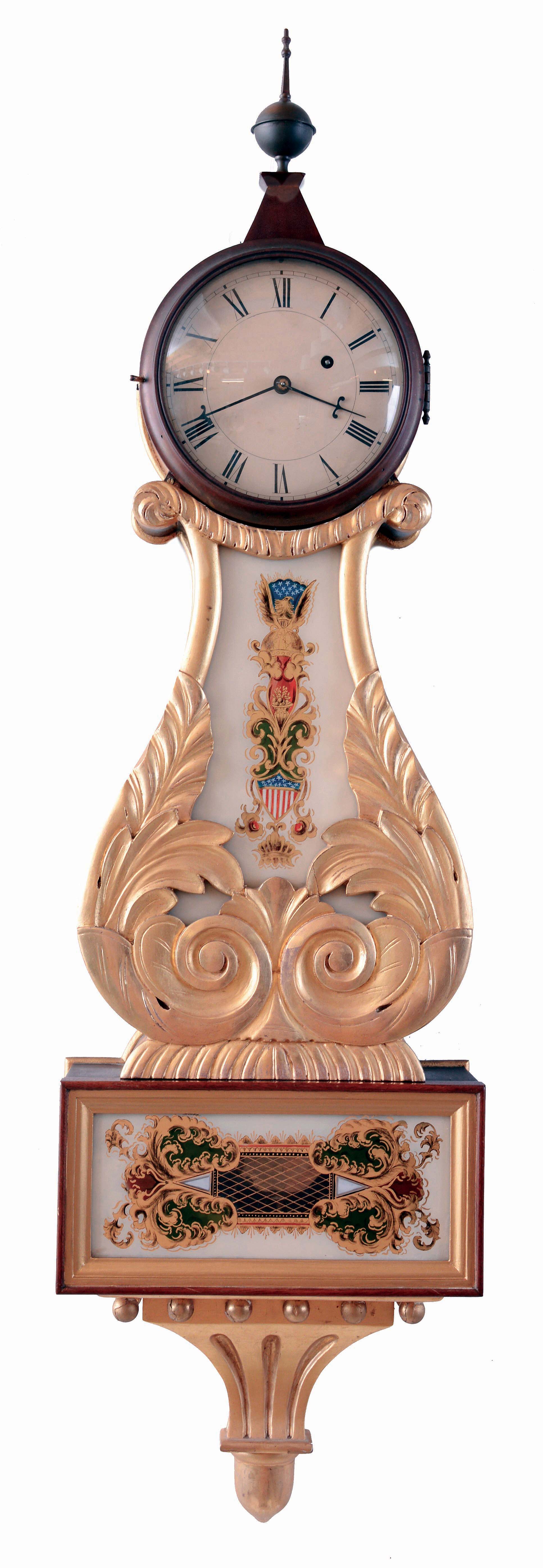 Lyre wall clock, weight driven, Massachusetts, gilt front mahogany case, leaf and scroll carved throat panel and lower door with paint decorated tablets, bottom with gilt bracket and acorn drop, Roman numeral painted metal dial, 8 days timepiece movement with front plate signed "E. Howard & Co., Boston 28 1/2", with Howard pendulum, 20th century. — Antique Clocks Price Guide