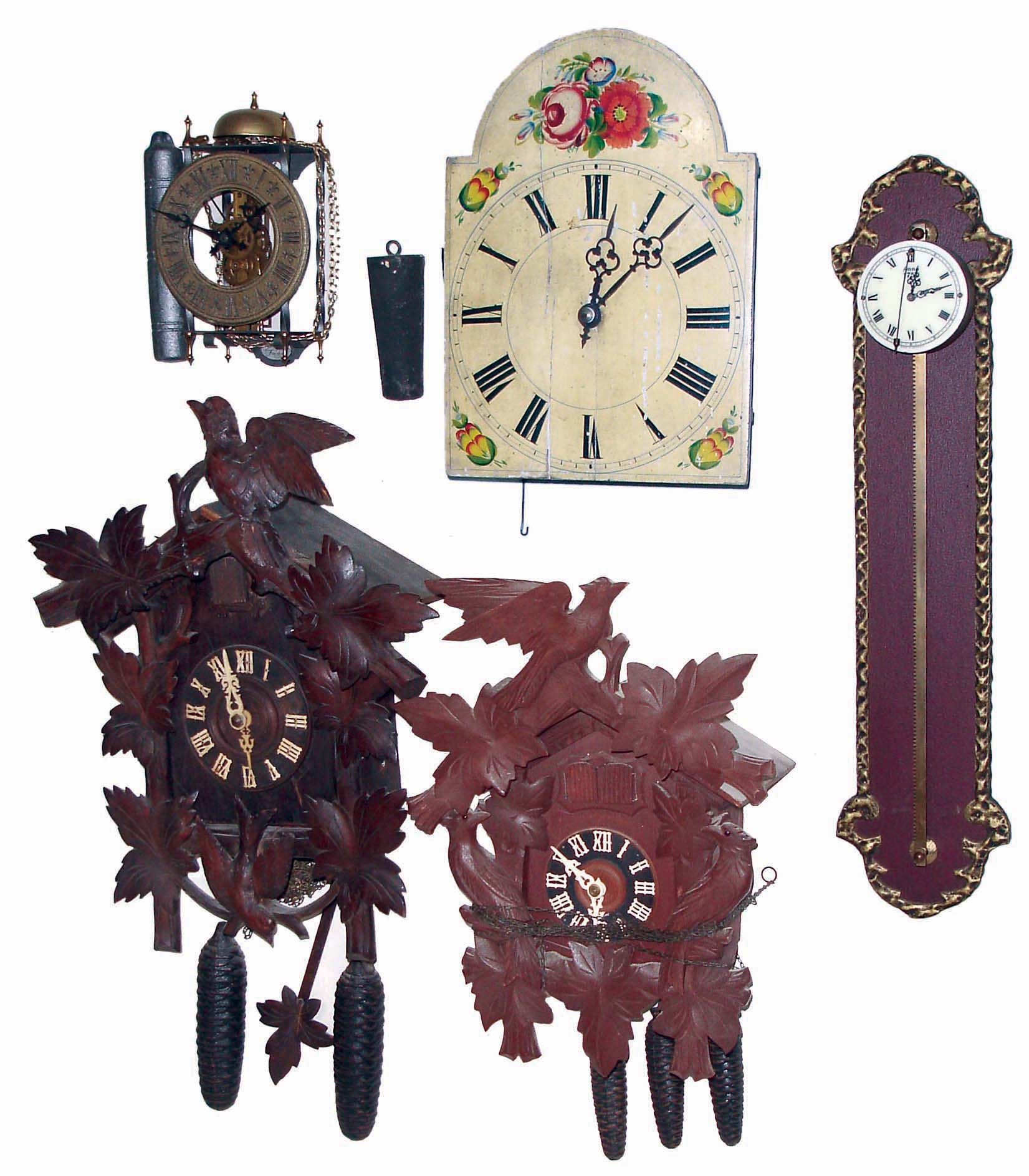 Clocks- 9 (Nine) weight-driven wall clocks: 3 German, 30 hours, cuckoos; Zan Daam reproduction; Gravity; Lantern; Wag-on-Wall; and Columbus; 20th century — Antique Clocks Price Guide