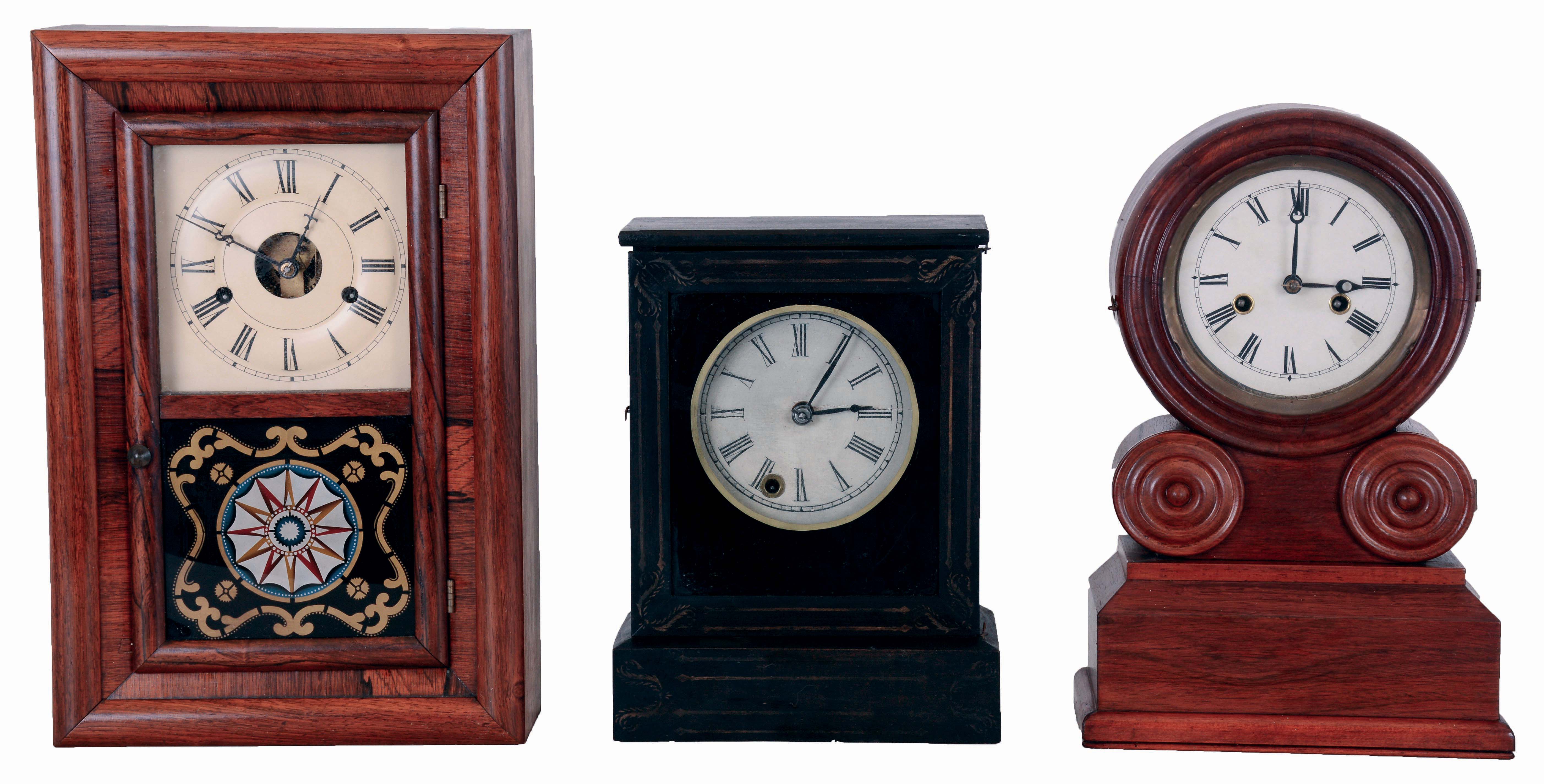Clocks- 3 (Three) American: (1) Chauncey Jerome, 30 hours, spring driven brass movement with a brass mainspring cottage timepiece, c1850; (2) E. Ingraham & Co., 30 hours, time and strike, spring driven brass movement "Grecian" shelf clock, c1875; (3) Seth Thomas, "Round Band" 30 hours, time and strike, with round plate movement, c1870. — Antique Clocks Price Guide