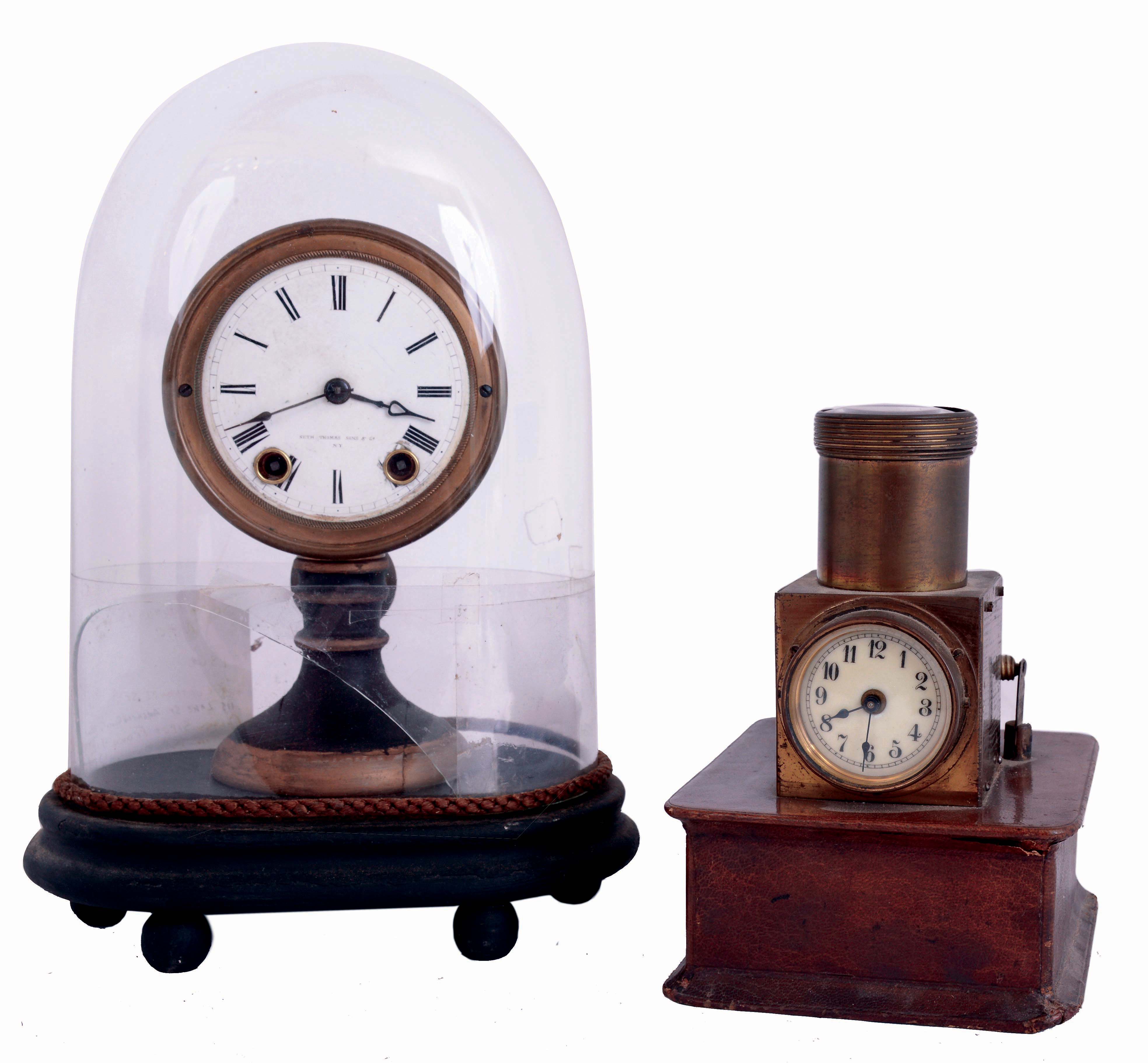 Clocks- 2 (Two): (1) Seth Thomas' Sons & Co., New York, candle stand clock, enamel dial, 8 day timepiece with glass dome, (2) English night projection table clock, 30 hour timepiece on wooden base, marked "J.C. Vickery Regent St W." — Antique Clocks Price Guide