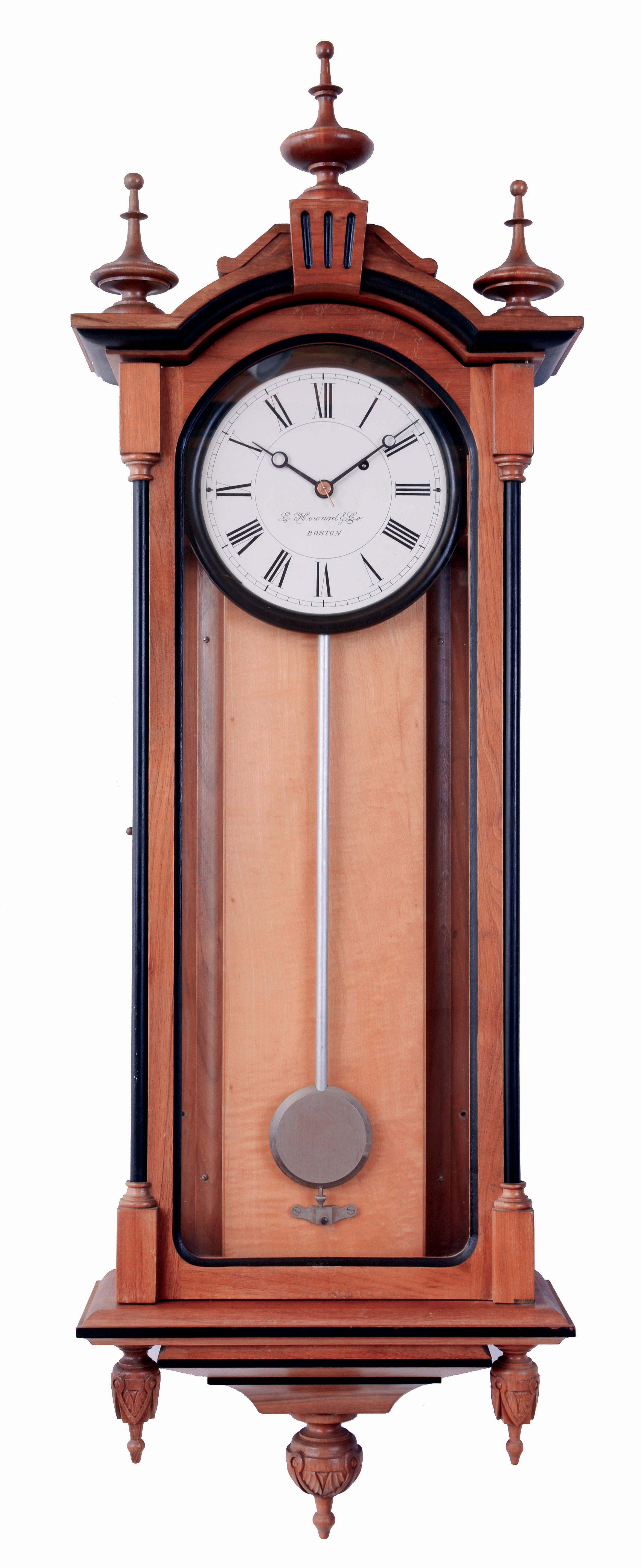 E. Howard & Co., Boston, Mass., "No. 59-8 Regulator" reissue. Walnut case with ebonized moldings, turned and carved finials, maple weight baffle, ebonized wooden bezel with Roman numeral white painted dial, blued steel moon hands, nickel pendulum with silver painted wooden rod, 8 days weight driven timepiece movement, with Howard paperwork, serial #0059, August, 1976 — Antique Clocks Price Guide