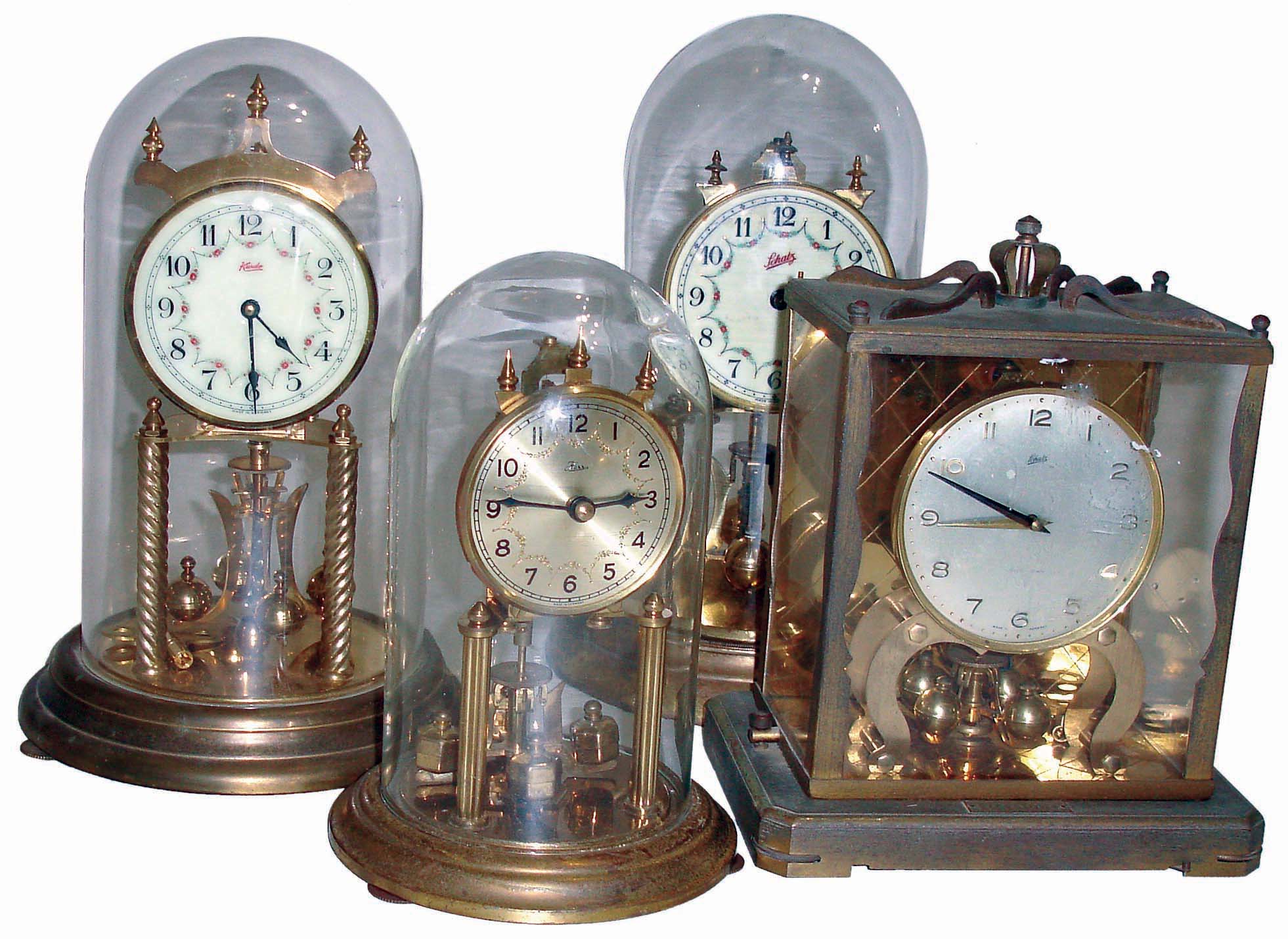 Clocks- 9 (Nine) German and English cuckoo, anniversary and marine: 3 Black Forest cuckoos including 1 large cuckoo and quail; 1Lux cuckoo; 4 German brass and glass 400-days; 1 Smith Astral English, 8 days, round brass marine with hinged bezel; early and mid 20th century — Antique Clocks Price Guide