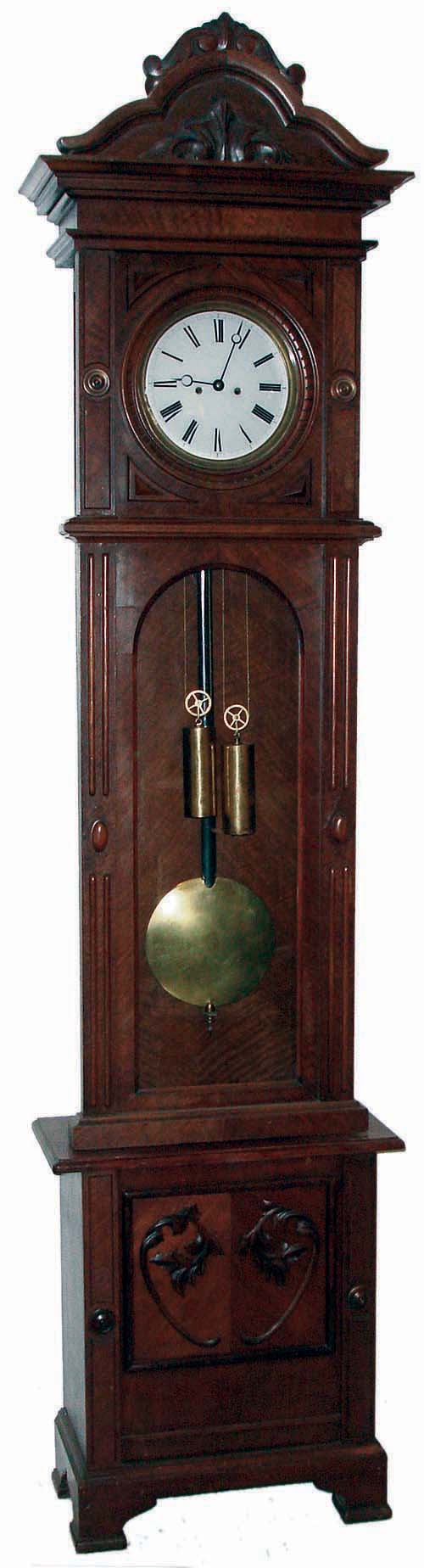 Lenzkirch, Germany, tall case clock, 8 days, time and bell strike, two brass--weight driven movement in a walnut case with an ornately carved top, applied carvings to base, cartouches on either side of door and white enamel dial, serial # 474673, c1879 — Antique Clocks Price Guide
