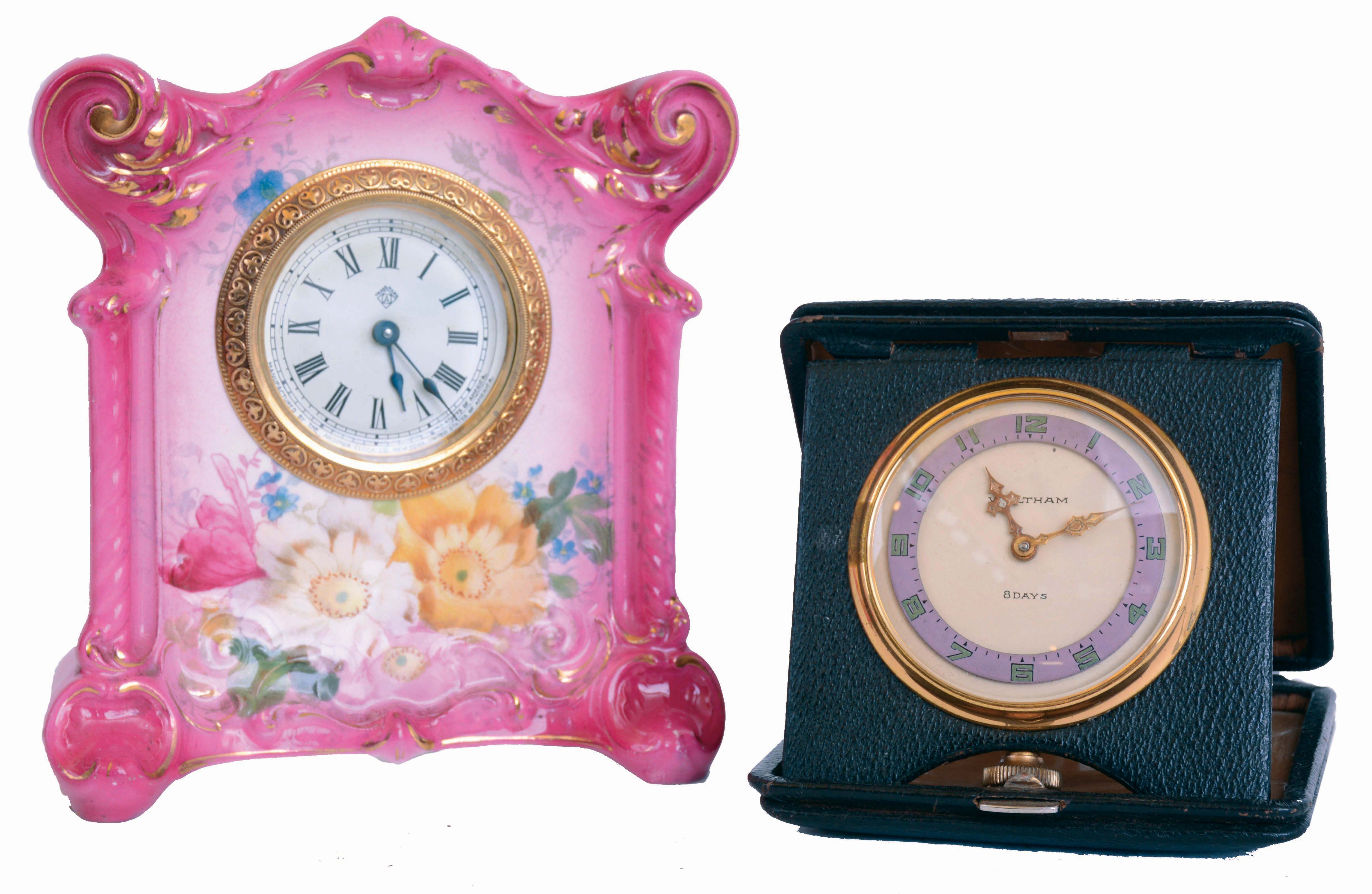 Clocks- 2 (Two): An Ansonia Royal Bonn desk or bedside clock, pink case with floral decoration, 30 hours timepiece movement, and a Waltham folding travel clock, painted metal dial with fancy gilt hands, 8 days timepiece movement, both c1900 — Antique Clocks Price Guide