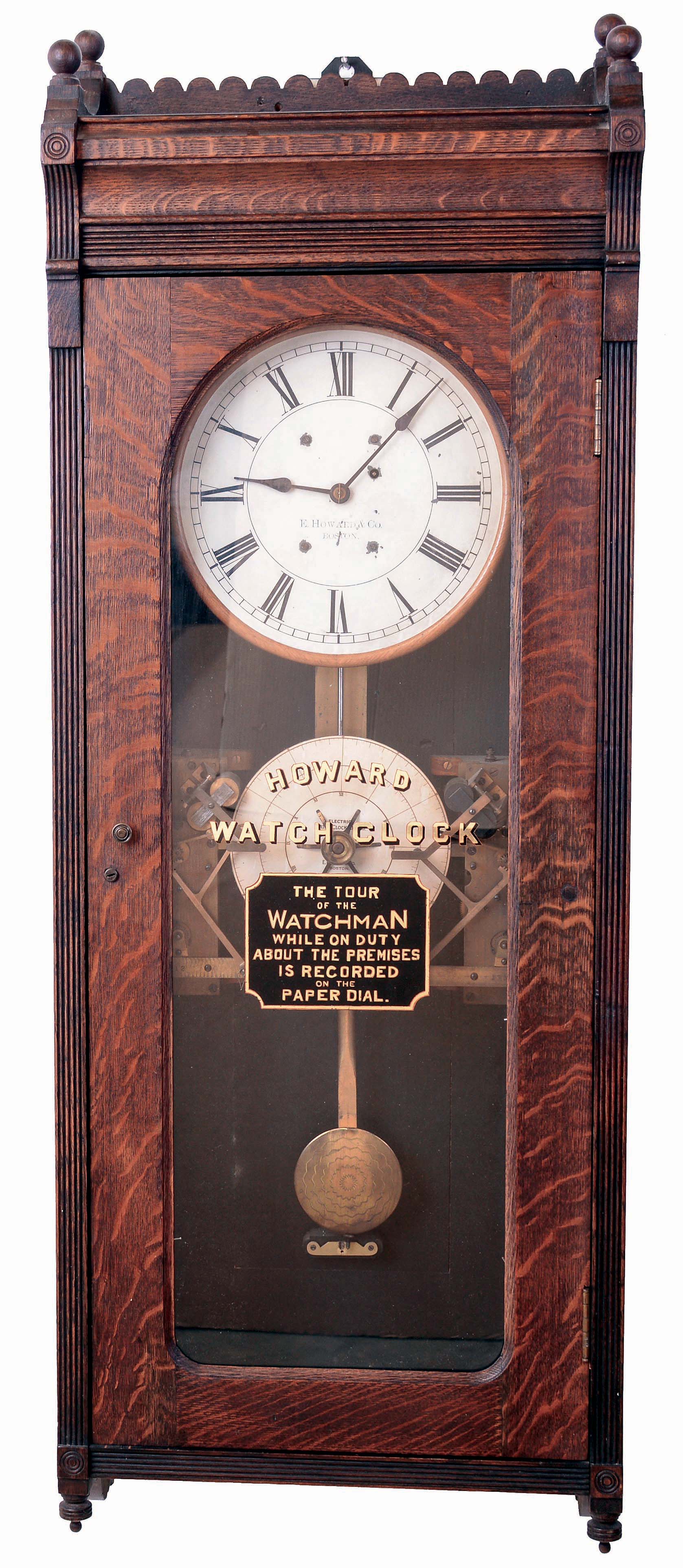 E. Howard & Co., Boston, Mass., "Watchman's Clock" with punch stations for two watchmen, wall clock, 8 days, time only, weight driven movement in an oak case with painted metal dial and reverse lettering on glass, c1888 — Antique Clocks Price Guide