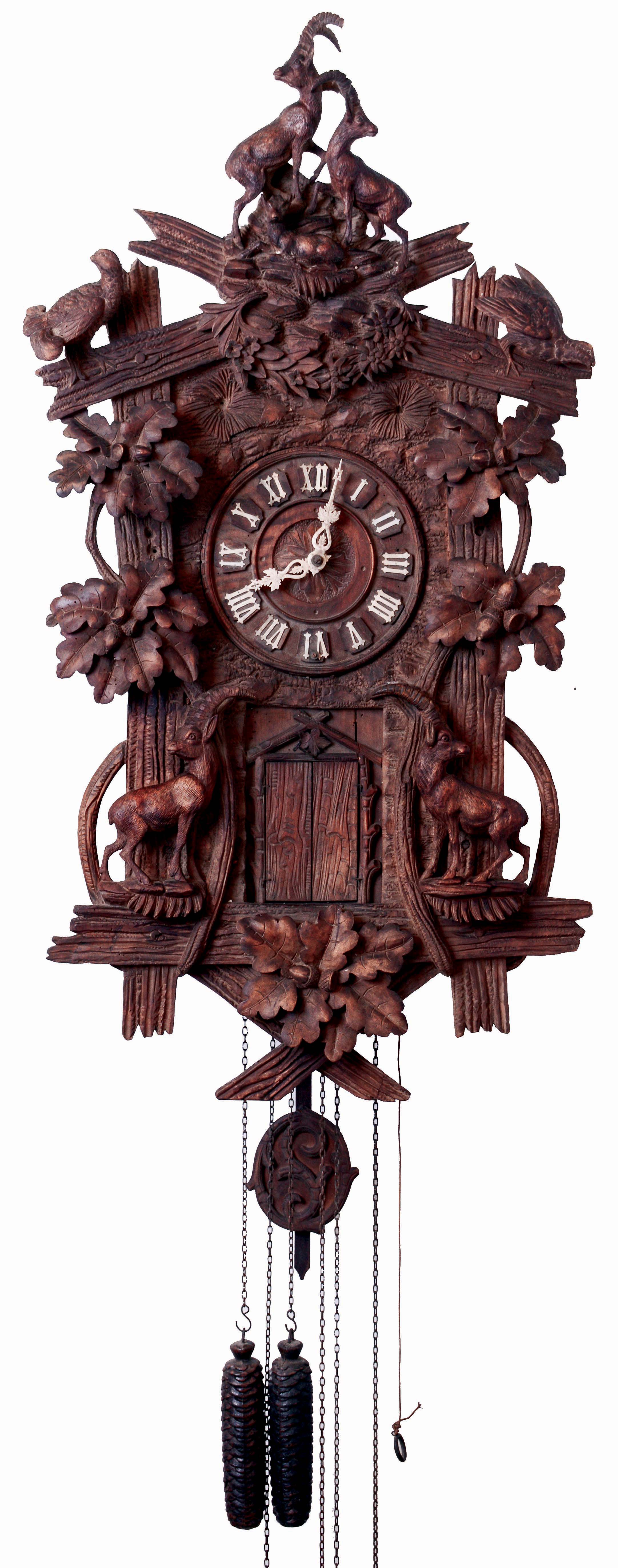 German, Black Forest, 8-note flute clock, this wall hanger profusely carved with Alpine Ibex {family of 3 at apex, and two adults lower], also oak leaves and acorns and the top rail with a quail on each side, 3-weight, one day, time, strike and music, as-found from a barn, Clock dates c1890 — Antique Clocks Price Guide