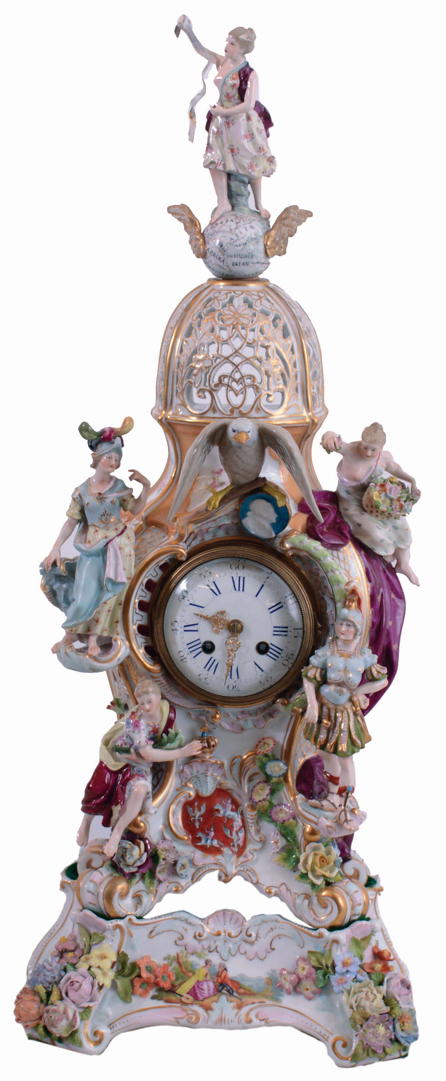 French, porcelain cased mantel clock in the rococo style, the pierced case has gilt and overglaze enamel decoration, the front with four female figures and an eagle with uncooperative legs, all surmounted by another female figure, standing on a winged globe, and resting on a matching porcelain base, Roman numeral white enamel dial with gilt Louis XV style hands, 8 days, pendule a Paris movement striking on a bell, and signed "Marti", c1880 — Antique Clocks Price Guide