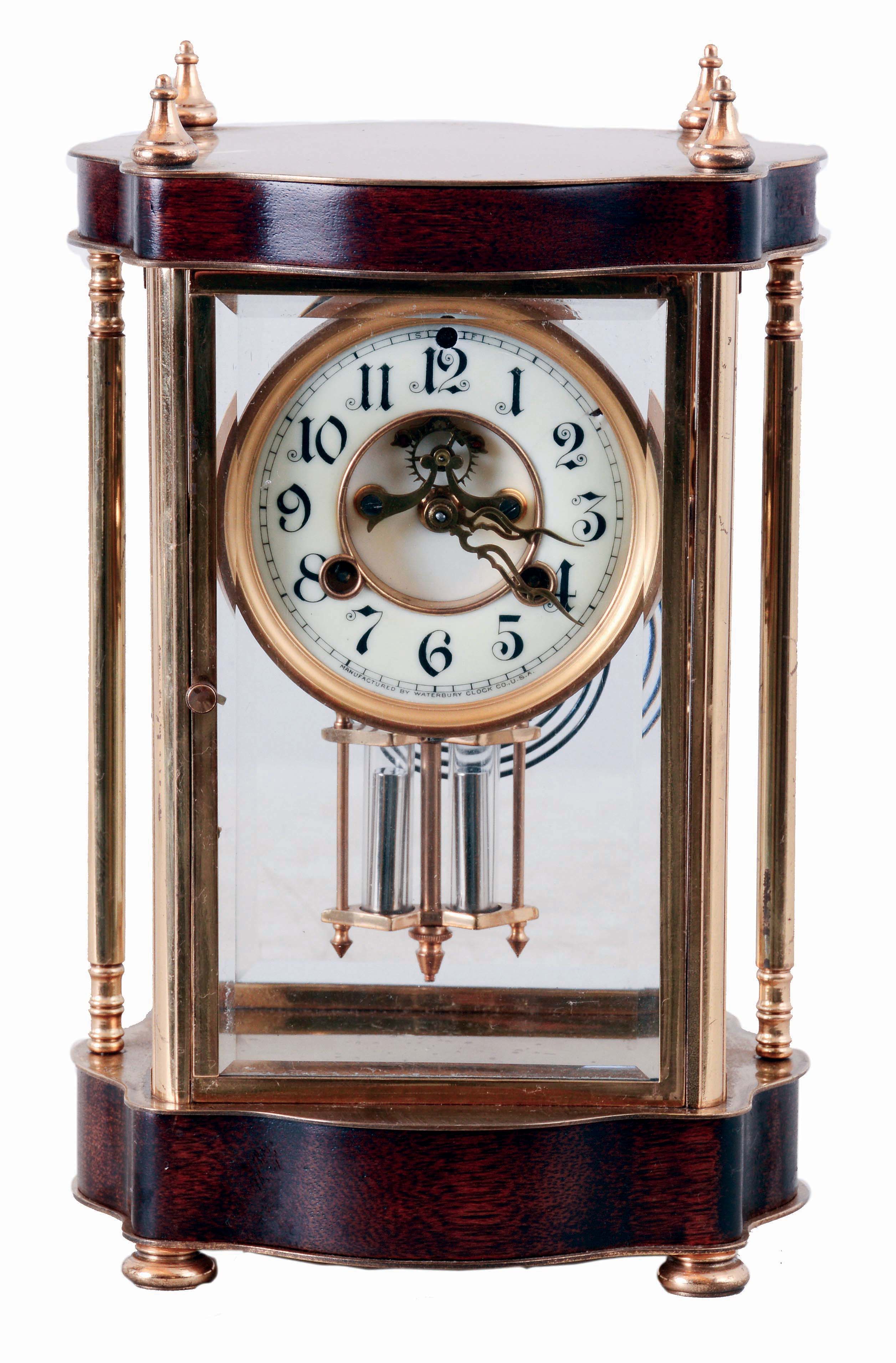 Clocks- 2 (Two) American: (1) Waterbury Clock Co., Waterbury, Conn., "Brittany", 8 days, time and strike, spring driven brass movement crystal regulator mantel clock, c1912; (2) William L. Gilbert Clock Co., "Curfew", 8 days, time and strike, spring driven brass movement mantel clock, c1910 — Antique Clocks Price Guide