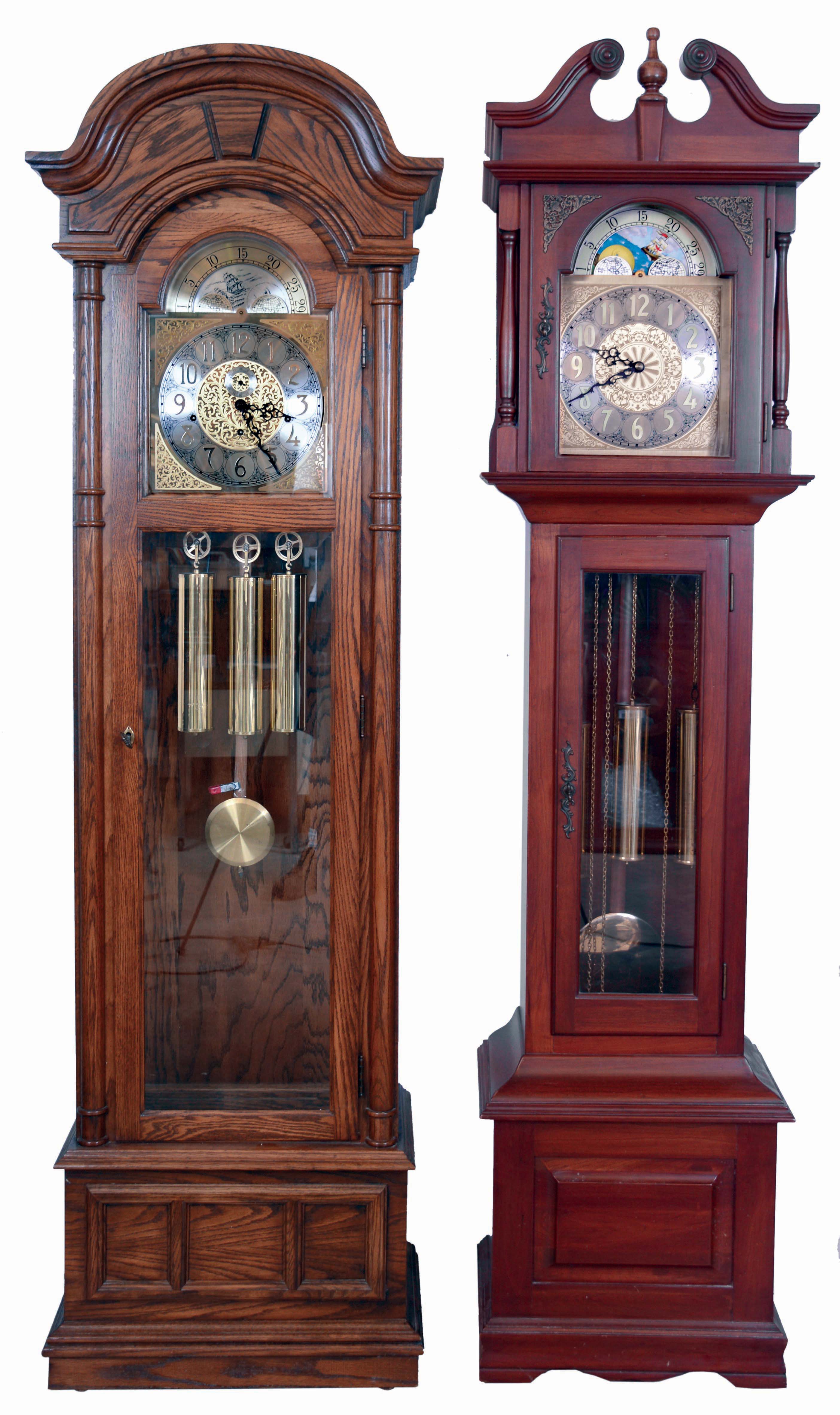 Tall clocks- 2 (Two): (1) Ridgeway, three train and three chimes- Westminster, Whittington and St. Michaels- in an oak case with arched top, c1970; (2) Empire, three train playing Westminster in an cherry case with broken arch top, c1970 — Antique Clocks Price Guide