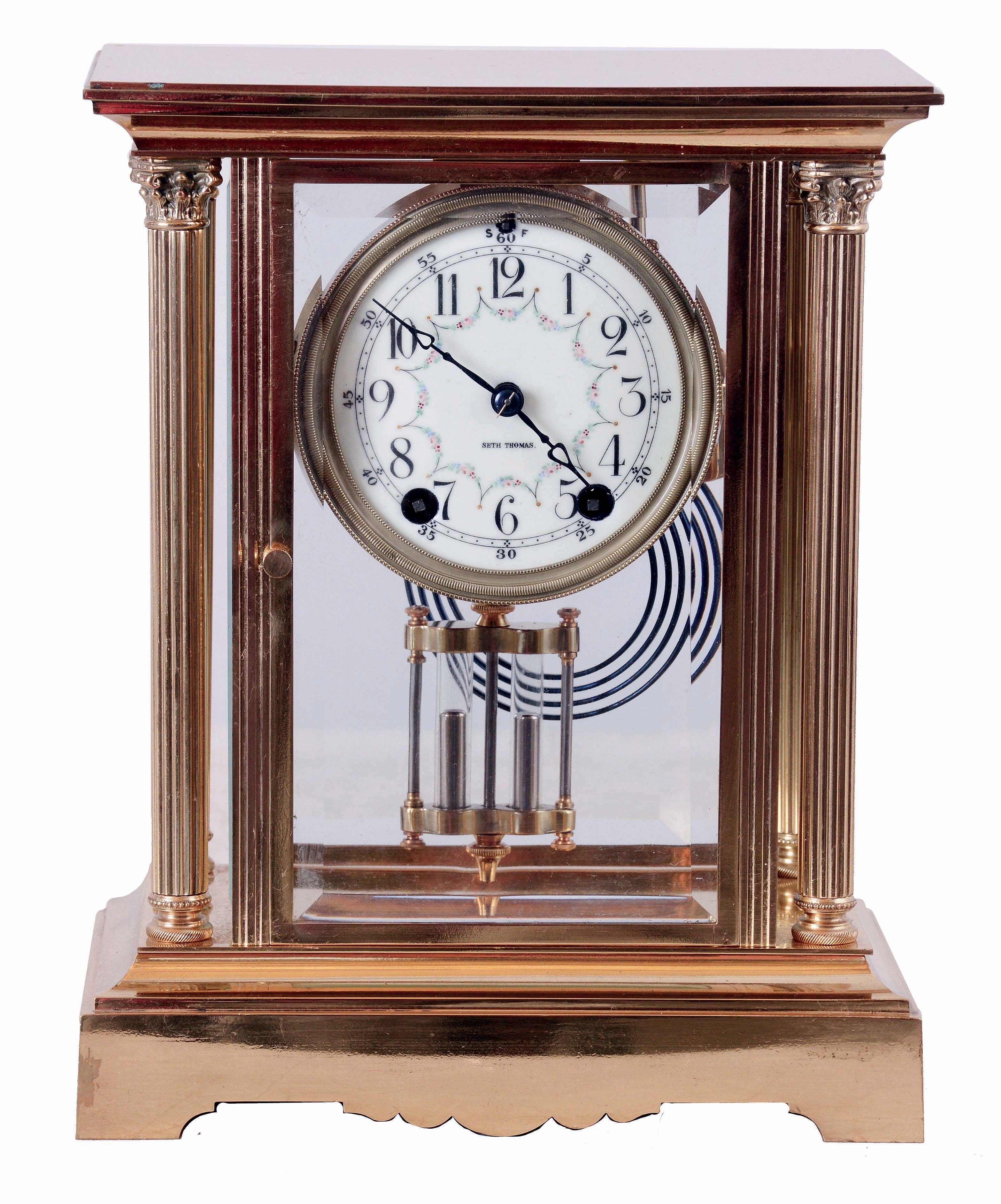 Seth Thomas Clock Co., Thomaston, Conn., "Empire No. 64" crystal regulator, 8 days, time and strike, spring driven movement, polished brass and glass case, c1909. — Antique Clocks Price Guide