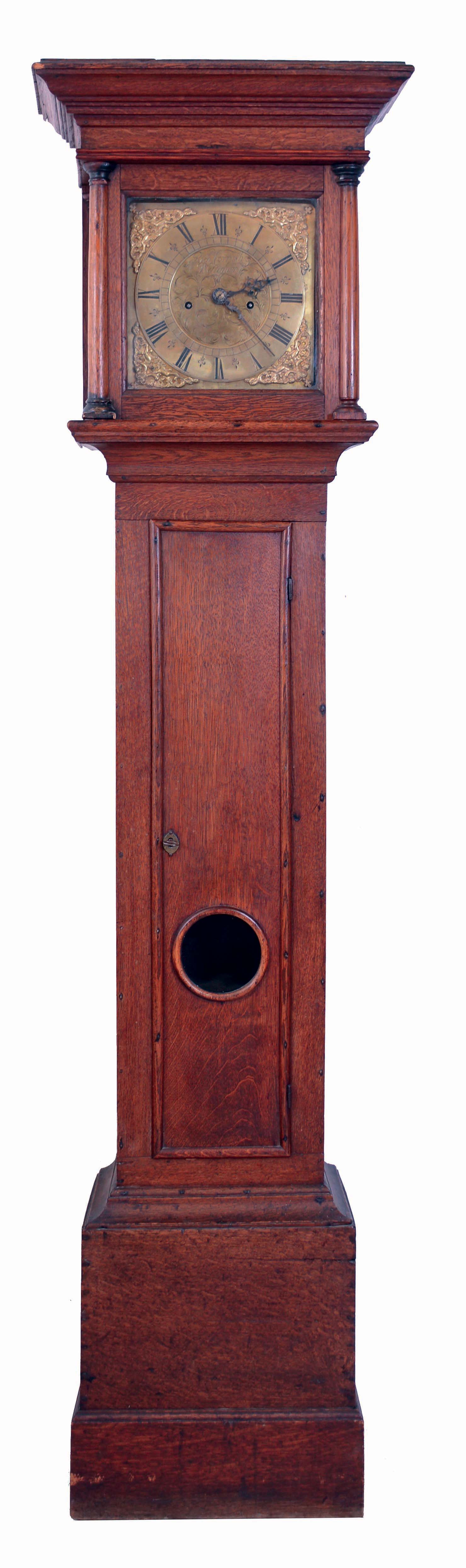 England, tall clock with engraved brass dial signed "Richard Cornish, Westerham" (County Kent). 8 days, time and strike, weight driven movement in an oak case with flat cornice top and glazed aperture for revealing pendulum, 18th century. — Antique Clocks Price Guide
