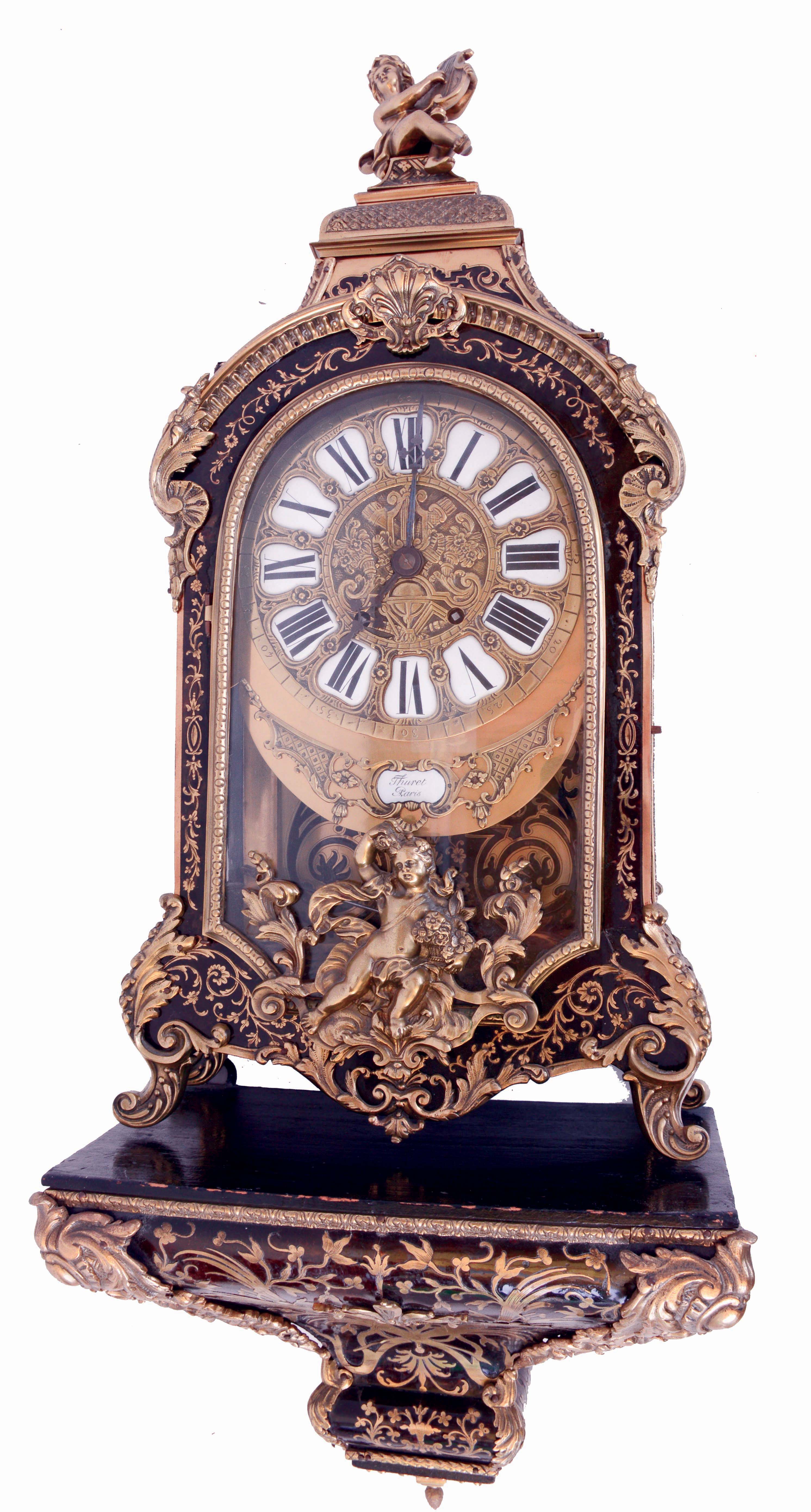 Bracket clock in the Louis XV style, boulle work case mounted with cast ornaments in the rococo style, the top with lyre playing putto, interior of the case also with boulle work, with its original, boulle work wall bracket, brass dial with Roman numeral cartouches and blued steel hands, signed "Thuret a Paris", 8 days, time and strike, spring driven movement with Brocot escapement, the back plate marked "Roblin & Fils Freres a Paris", c1870 — Antique Clocks Price Guide