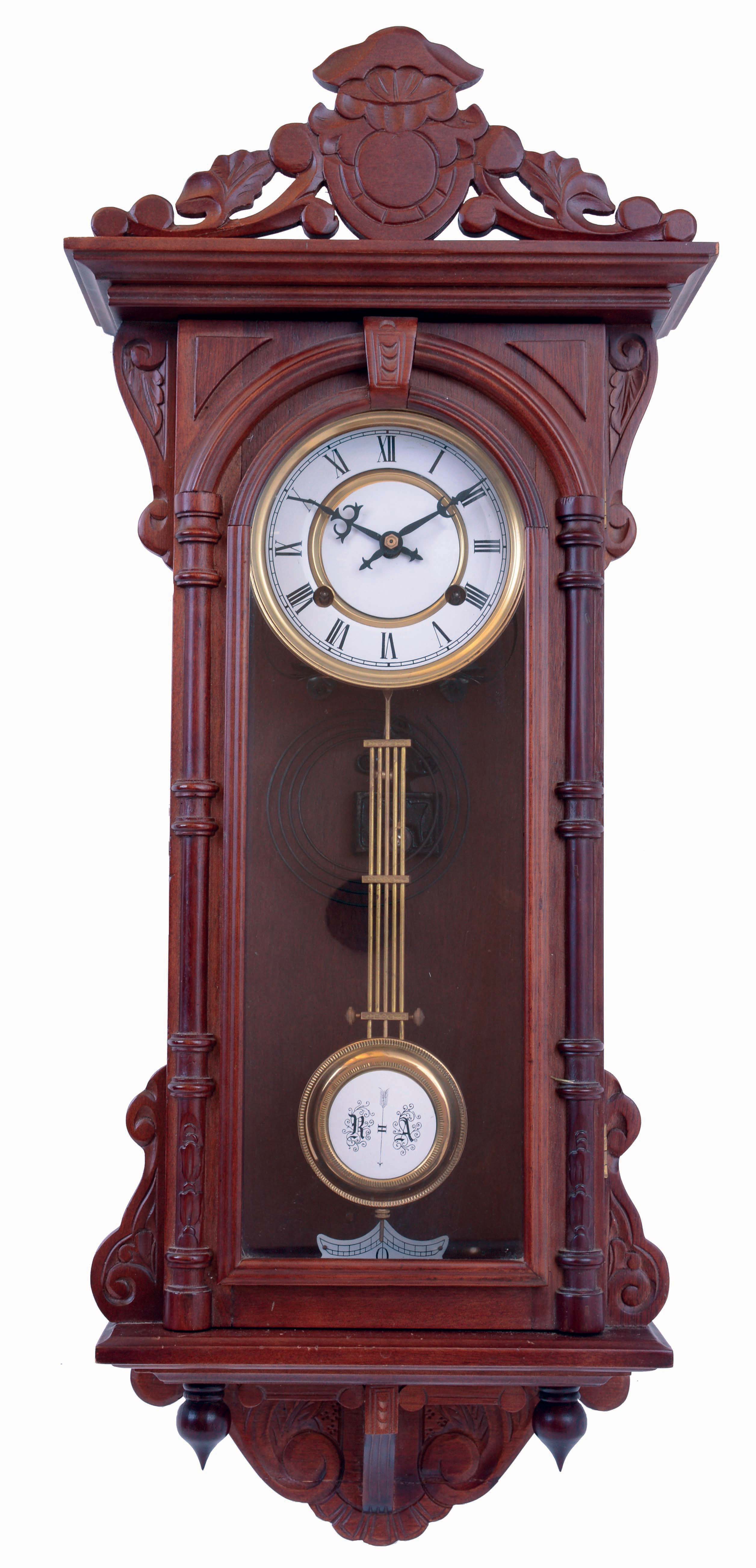 Clocks- 4 (Four), 8 days, time and strike, wood case wall clocks: Howard Miller with German works; Ansonia reproduction with Asian works; Asian with Westminster chimes; Korea, Vienna regulator style wall clock, hardwood case with turned and carved ornament, Roman numeral painted metal dial, 8 days, time and strike movement, 20th century — Antique Clocks Price Guide