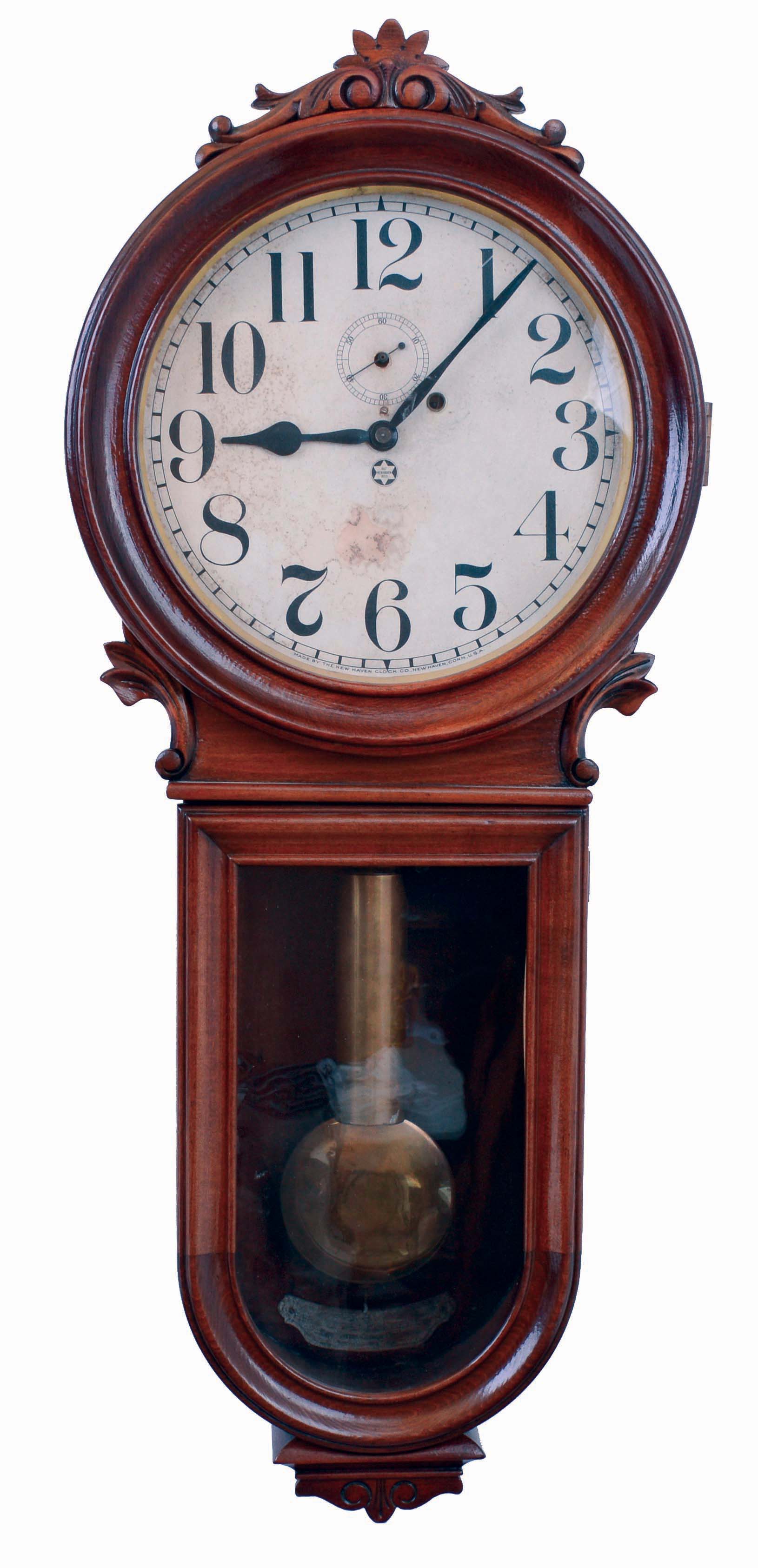 New Haven Clock Co., New Haven, Conn., "Glenor", keyhole style wall clock, 8 days, time only, brass weight driven movement in a mixed wood case papered metal dial, c1913 — Antique Clocks Price Guide