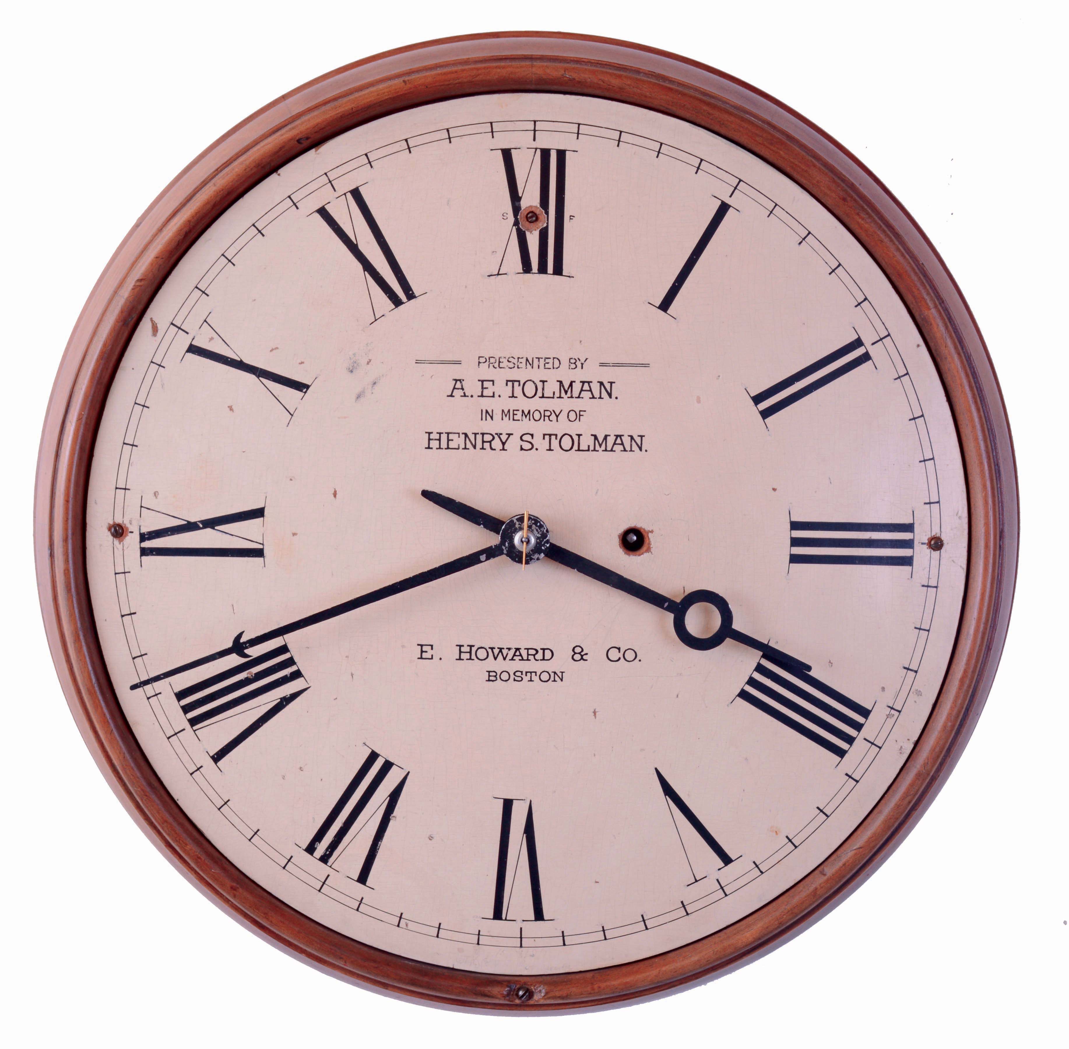 E. Howard & Co., Boston, Mass., gallery clock, turned pine case, Roman numeral, white painted wooden dial with presentation below 12:00 "Presented by A.E. Tolman In Memory of Henry S. Tolman", 8 days, spring driven, nickel plated timepiece movement, the front plate marked "E. Howard & Co., Boston 8 3/4", c1925 — Antique Clocks Price Guide