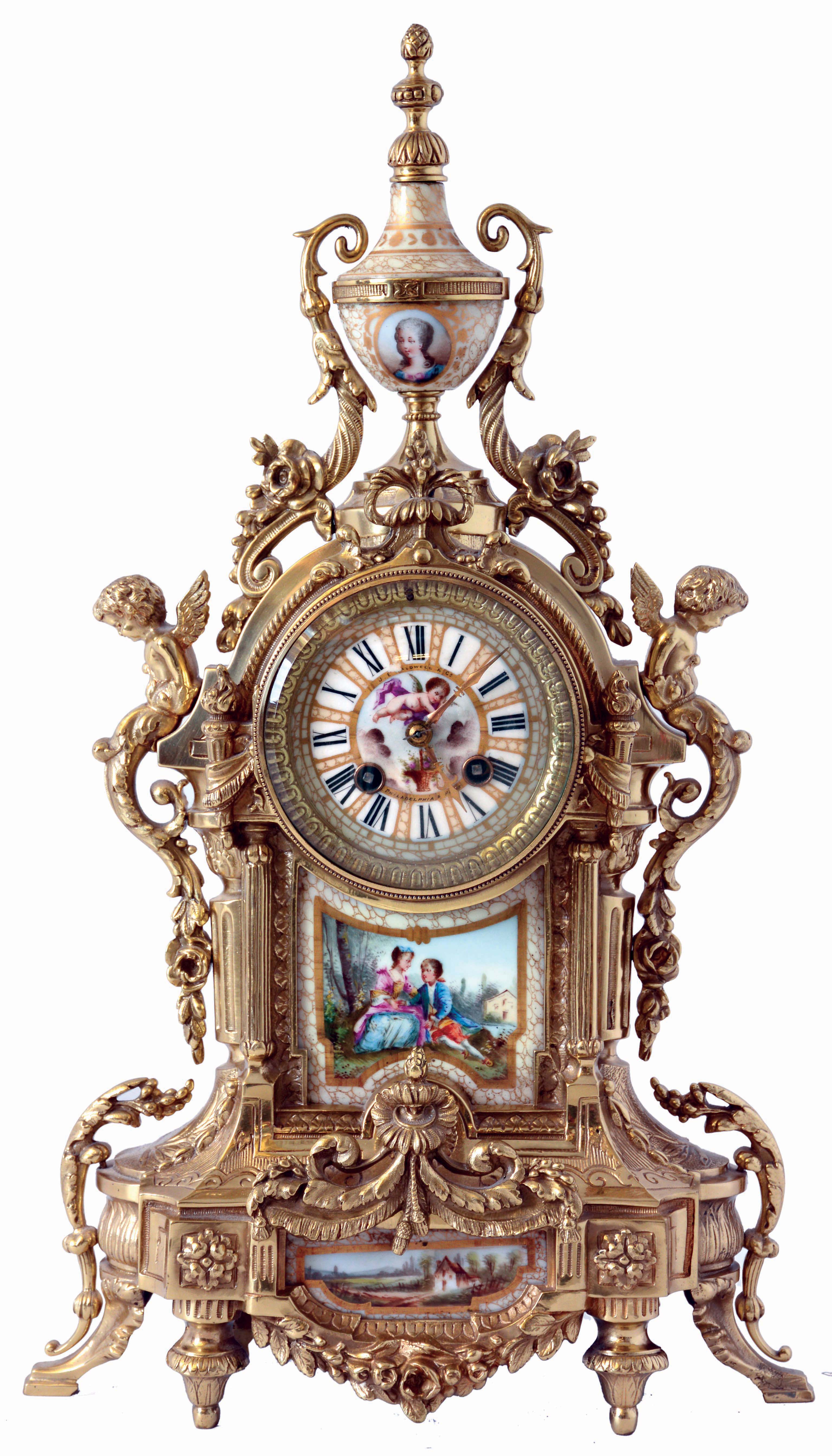 Samuel, Marti, France, for J.E. Caldwell & Co., Philadelphia & Paris, mantel clock, cast brass case with architectural and naturalistic ornament, the front set with a painted porcelain panel depicting a young couple in a landscape, the top with porcelain urn decorated with a portrait of a young woman, Roman numeral porcelain dial with gilding, and putto with basket of flowers, 8 days, time and strike pendule a Paris movement, c1900 — Antique Clocks Price Guide