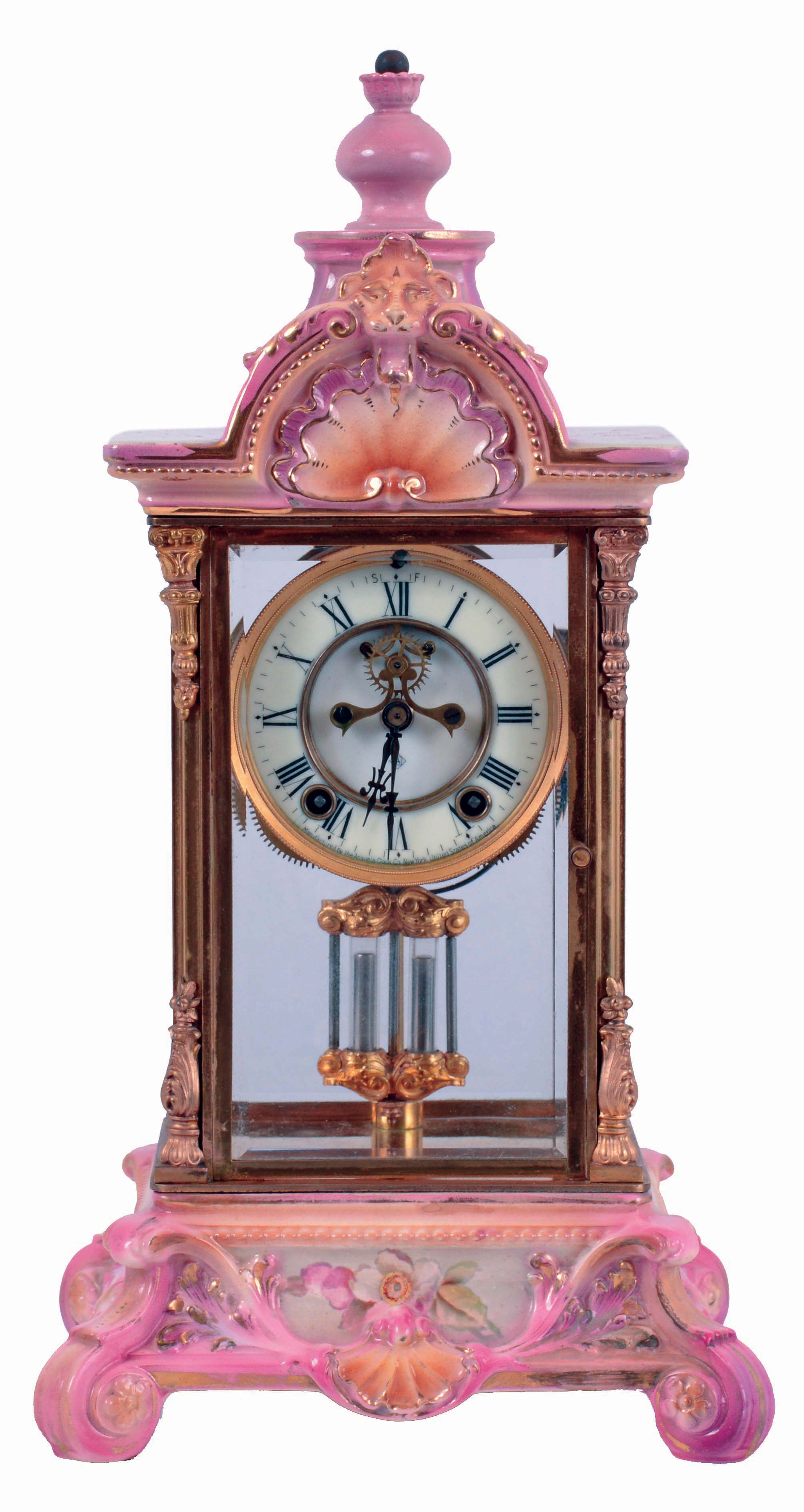 Ansonia Clock Co., New York, NY, "Crystal Regulator No. 4" in a gilt and brass case with a Royal Bonn top and base and a spring driven, 8 days, time and hour/half-hour strike movement with a visible escapement, c1914. — Antique Clocks Price Guide