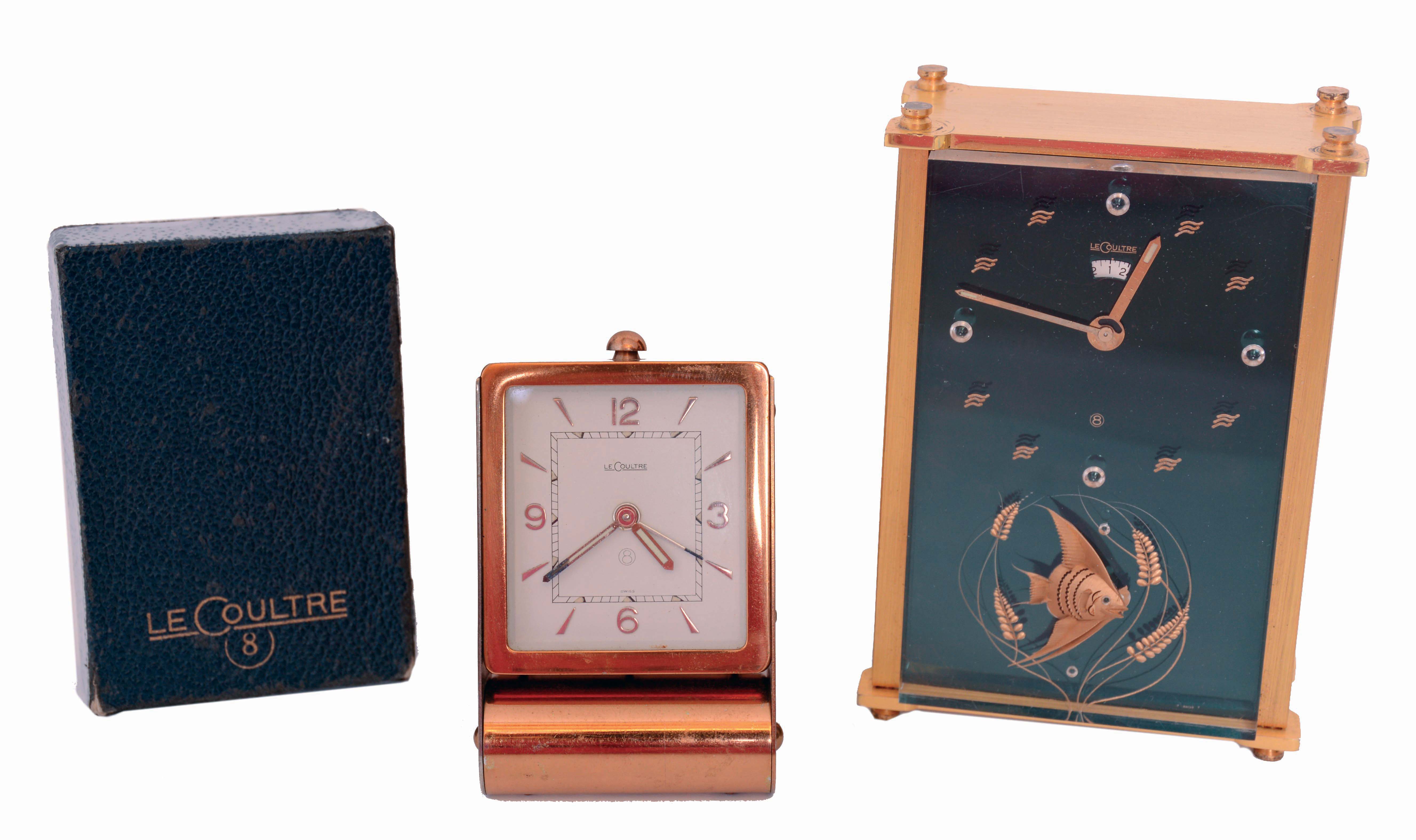 Clocks- 2 (Two): Both LeCoultre, the first a ref. 2173 musical alarm clock, gilt case with lucite dial, and gilt luminous stick hands, the other a folding travel alarm clock, lacquered brass folding case with Arabic numeral and arrow marker metal dial and luminous baton hands, with its original box and instructions, both mid 20th century — Antique Clocks Price Guide