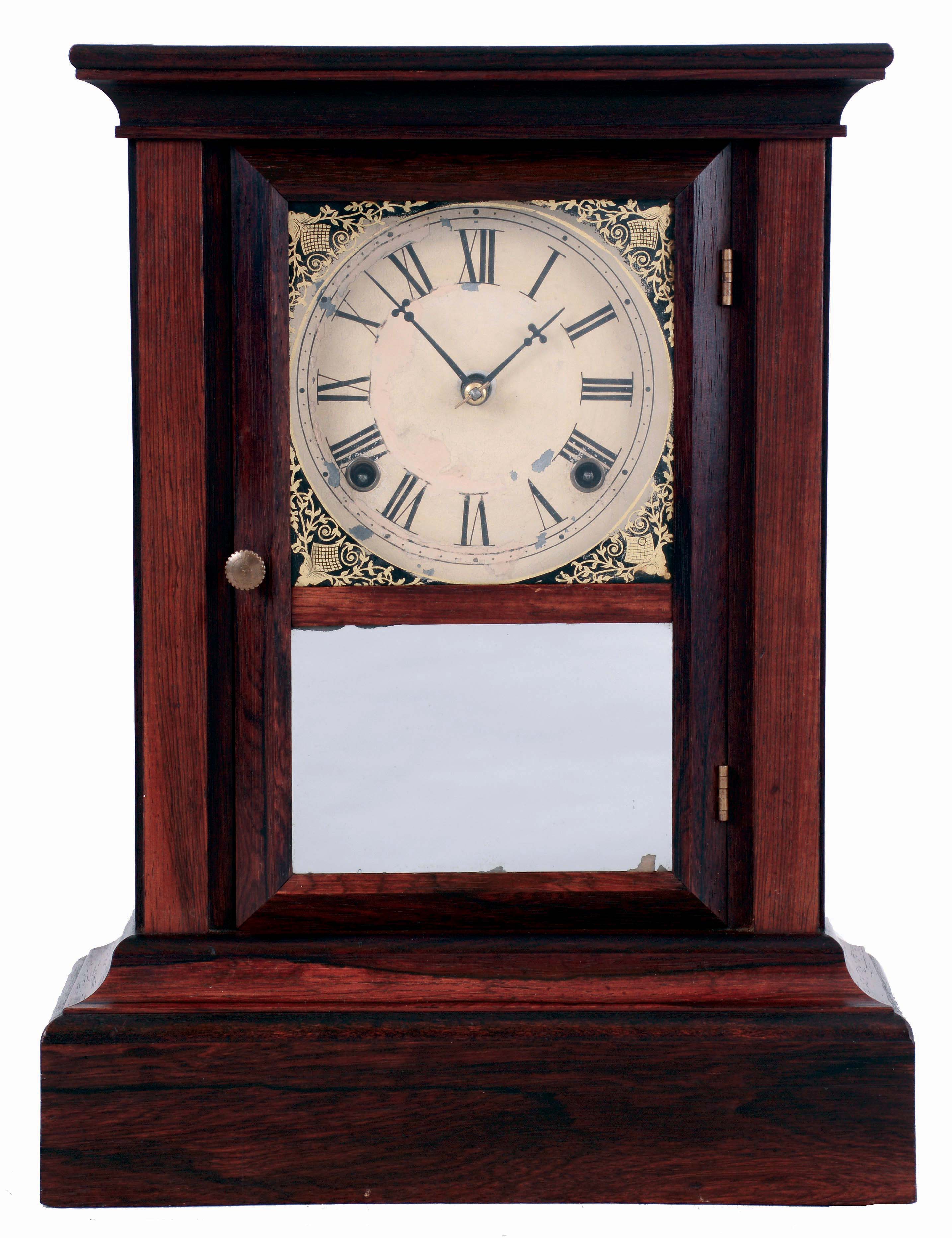 Atkins Clock Co., Bristol, Conn. Cottage mantel clock in a rosewood veneered case with a spring driven, 8 days, time and strike movement, c1870. — Antique Clocks Price Guide