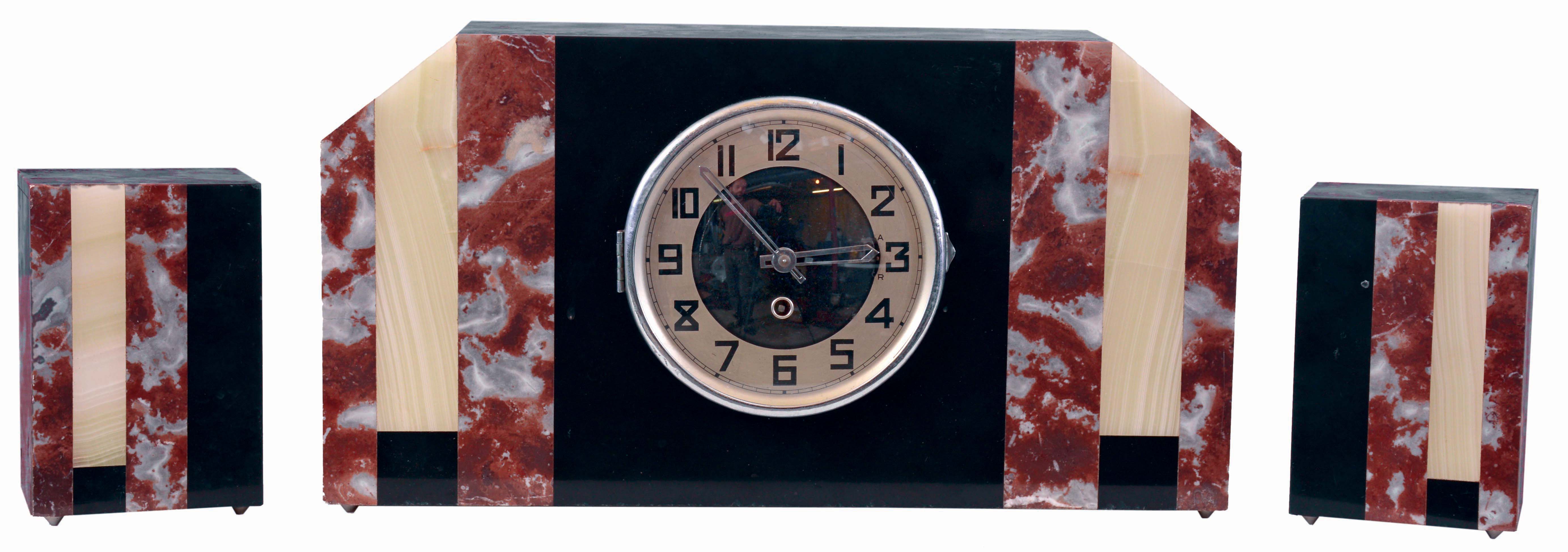 Clocks- 3 (Three): (1) French, 8 days, time and strike, spring driven brass movement porcelain mantel clock. (2) German, 30 hours, spring driven brass movement black and pink marble with contrasting marble inlay art deco style garniture set. (3) French, 8 days time only carriage clock, brass case and enamel dial — Antique Clocks Price Guide