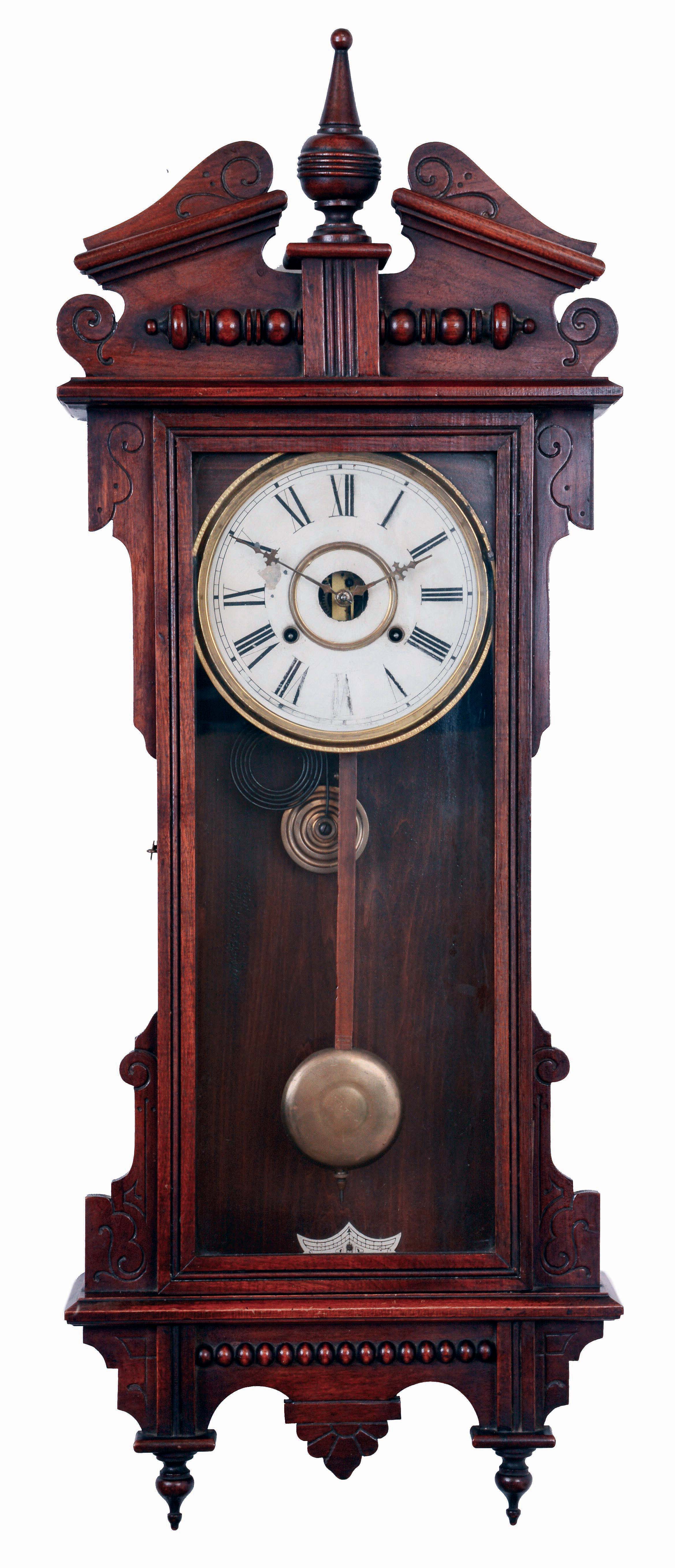 Waterbury Clock Co., Waterbury, Conn., "Eton" wall hanging clock in a walnut case with a spring driven, 8 days, time and strike movement, c1906. — Antique Clocks Price Guide