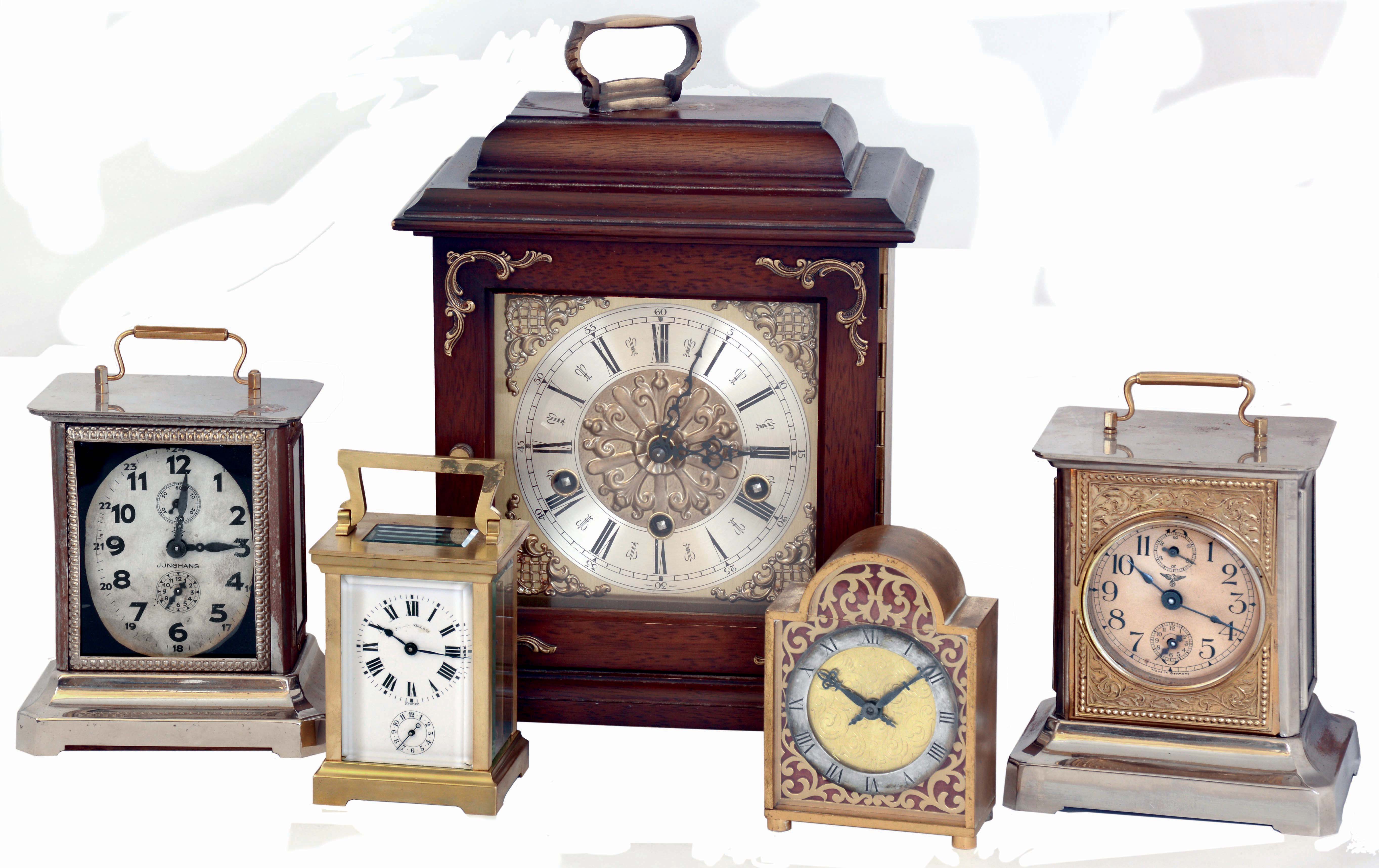 Clocks- 5 (Five) carriage, desk and mantel clocks: French, Duverdrey & Bloquel for J.E. Caldwell, 8 days, time and alarm brass and glass carriage clock; Mauthe German nickel-plate, 30 hours, carriage clock with music box (Home Sweet Home) in base; Ch.Hour, France, arch-top brass, 8 days, time only desk clock; Junghans nickel-plate, 30 hours carriage clock with music box (Carmen) in base; Western Germany hardwood, 8 days, triple-chiming bracket clock with Urgos floating-balance movement. all 20th century — Antique Clocks Price Guide