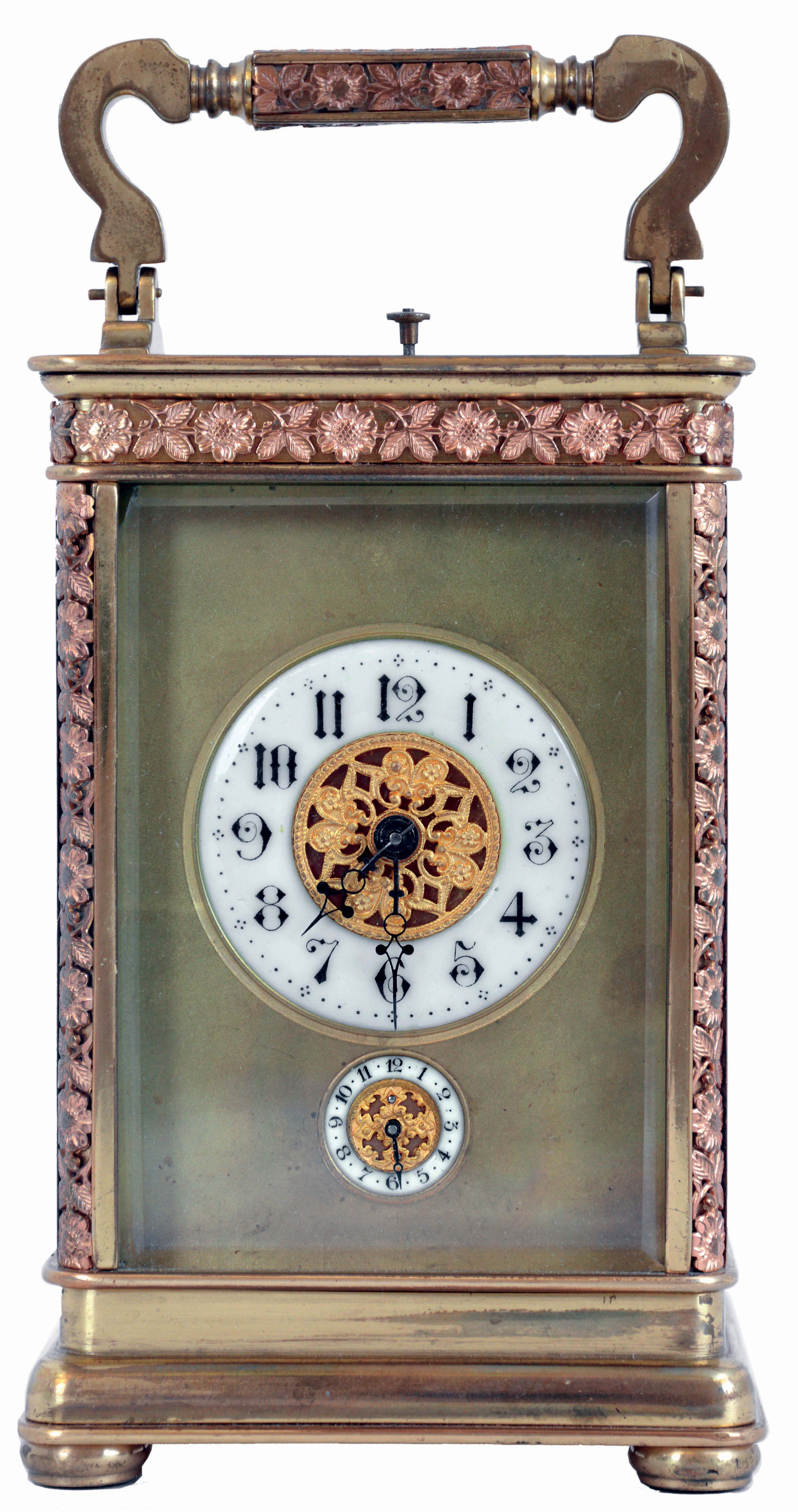 France, carriage clock, gilt brass case with applied foliate ornament, and five beveled glass panels, Arabic numeral white enamel alarm and time dials, each with gilt, ornamental center, and with a matte gilt mask, fancy blued steel hands, 8 days, time and strike movement with lever platform, announcing the hours and half hour on a coiled gong, and repeating the last hour on demand, c1900 — Antique Clocks Price Guide