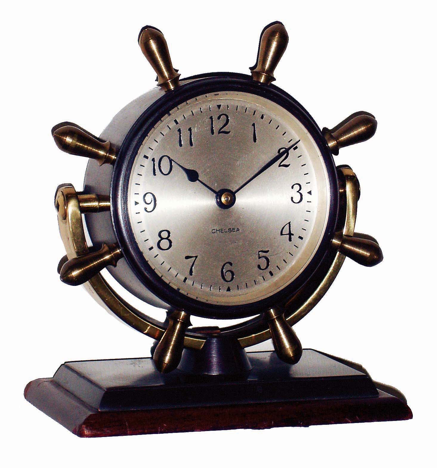 Chelsea Clock Co., Boston, Mass., "Comet", bronze on mahogany base, 8 days, time only swivel head yacht wheel desk clock, c1948 — Antique Clocks Price Guide