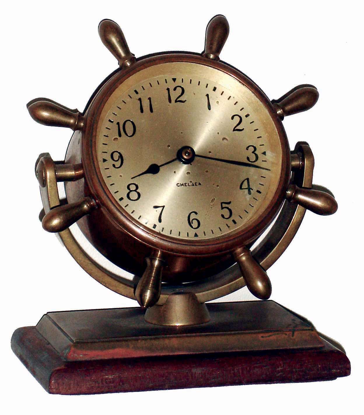 Chelsea Clock Co., Boston, Mass., "Comet", bronze on mahogany base, 8 days, time only swivel head yacht wheel desk clock, c1948 — Antique Clocks Price Guide