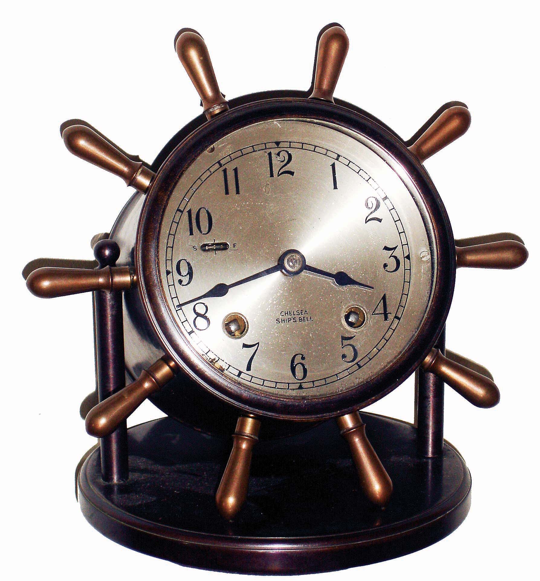 Chelsea Clock Co., Boston, Mass., "Vanderbilt" yacht wheel swivel head, 8 days, ship's bells desk clock, bronze finish, hinged bezel, #631082, c1957 — Antique Clocks Price Guide