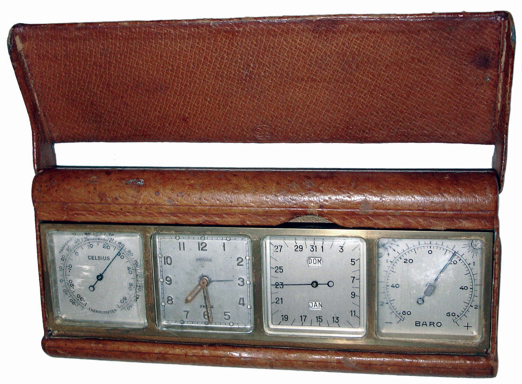 Angelus, Swiss-made four dial weather station in brass, leather and clear acrylic case, 8 days movement with alarm, calendar, barometer and Celsius thermometer, c1955 — Antique Clocks Price Guide