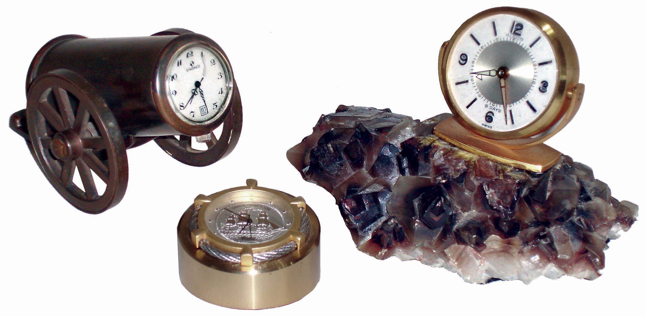 Clocks- 3 (Three) modern novelty clocks: Sindaco Swiss 1-jewel in bronze cannon; Chelsea/Shreve, Crump & Low small nautical theme with Japanese battery movement; LeCoultre 8 days, alarm clock on rock crystal base; 20th century — Antique Clocks Price Guide