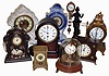 Clocks- 9 (Nine) Novelty, Porcelain, Swinger, Carriage, Mantel: includes Horolovar flying ball and Briggs rotary; modern figural swinger (Asian); 3 porcelain including Waterbury with visible escapement; French time & alarm carriage clock; and small French mantels; early and later 20th century