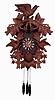 German, large carved cuckoo clock, 3-bird and 10-leaves with 3 chicks in the nest, cuckooing on the hour and a single call on the half hour, and the hours followed by a lively musical tune, with the left door at top opening up to reveal the "conductor", pull wind 3 weights each day, c1985